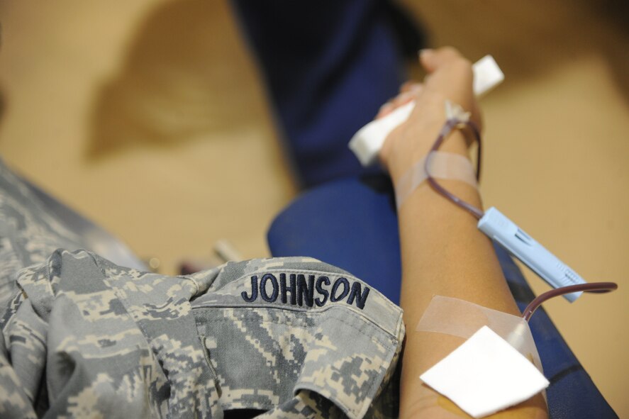 U.S. Air Force Airman 1st Class Iyannika Johnson, 23rd Aerospace Medicine Squadron public health technician, waits as her blood is drawn at Moody Air Force Base, Ga., Oct. 26, 2011. Technicians asked donators a series of questions to assure they met donation criteria and were capable of giving blood.  When cleared through questions, each donator gave more than a pint of blood. (U.S. Air Force photo by Airman 1st Class Paul 