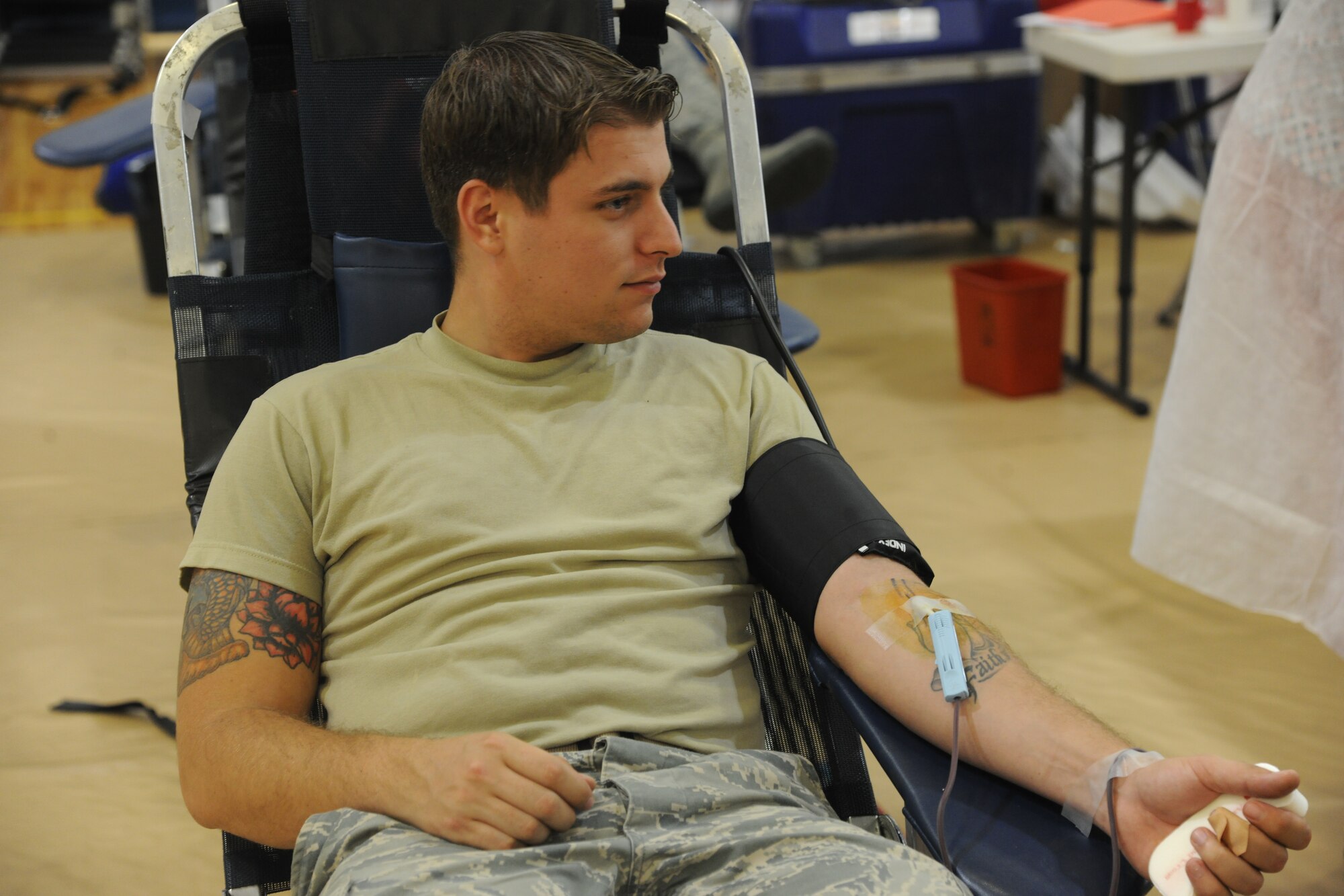 U.S. Air Force Staff Sgt. Brian Alicea, 23rd Force Support Squadron, donates blood during an American Red Cross blood drive at Moody Air Force Base, Ga., Oct. 26, 2011. Alicea has given blood almost 15 times in his life and doesn’t plan on stopping. He said he gave blood to help out people in need. (U.S. Air Force photo by Airman 1st Class Paul Francis/Released)
