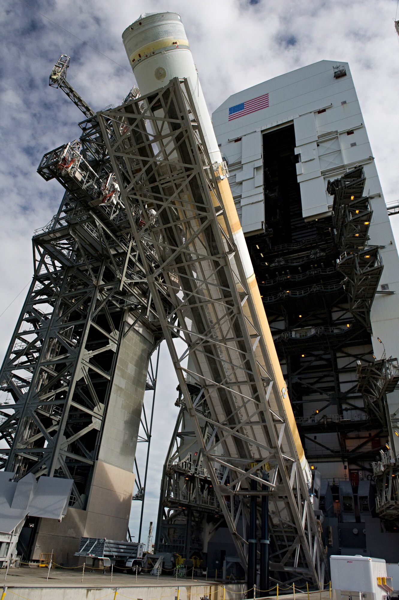 CAPE CANAVERAL AIR FORCE STATION, Fla. -- A United Launch Alliance Delta IV booster is erected from horizontal to vertical on Pad 37. The Launch Vehicle on Stand erection took place Oct. 11, 2011. The rocket is being prepared for the launch of Wideband Global Satcom-4 scheduled Jan. 19, 2012. (U.S. Air Force photo/Julie Dayringer)