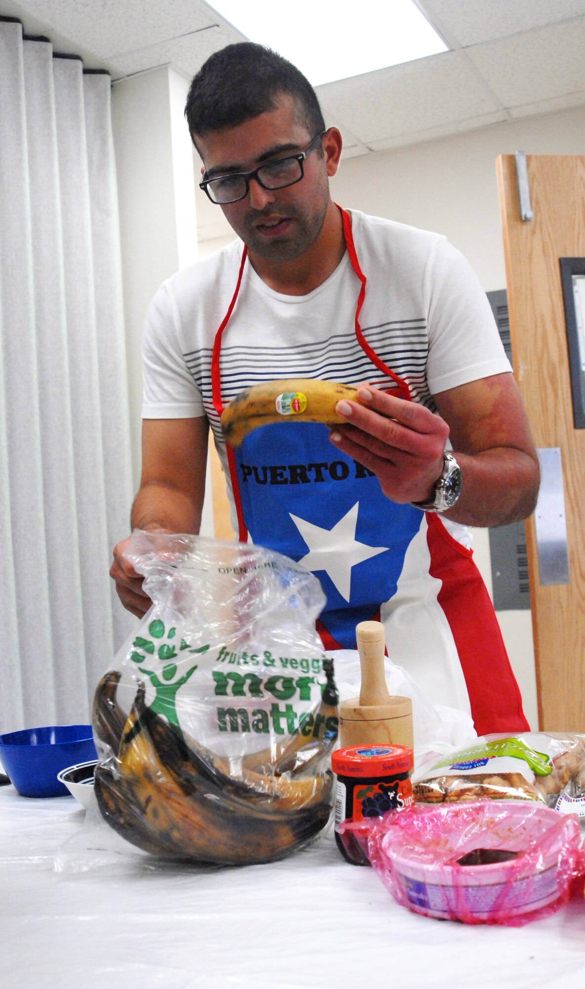 GOODFELLOW AIR FORCE BASE, Texas—Airman 1st Class Julio Alvarado, 315th Training Squadron prepares to make three dishes using plantains, the ingredient during the final round of the ‘Iron Chef’ competition at Crossroads here Oct. 22. His team, Tu Madre, placed second. (U.S. Air Force photo/Airman 1st Class Jessica Keith)