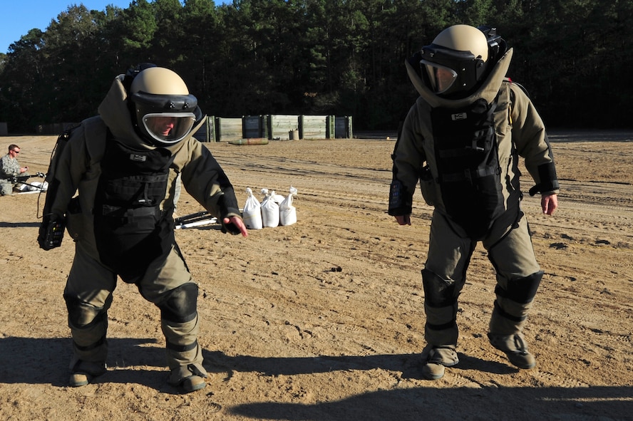 Chief Master Sgt. Blake Malpass, 4th Fighter Wing command chief, challenges Col. Patrick Doherty, 4 FW commander, to a foot race back to the bunker at the Explosive Ordnance Disposal range on Seymour Johnson Air Force Base, N.C., Oct. 25. The challenge came after hearing about Airmen in the EOD flight running a 5K in the blast resistant bomb suits to raise money and awareness for the EOD Wounded Warrior Foundation and the EOD Memorial Foundation. Malpass is originally from Greensboro, N.C., and Doherty is a native of Lincoln, Neb. (U.S. Air Force photo by Senior Airman Rae Perry)