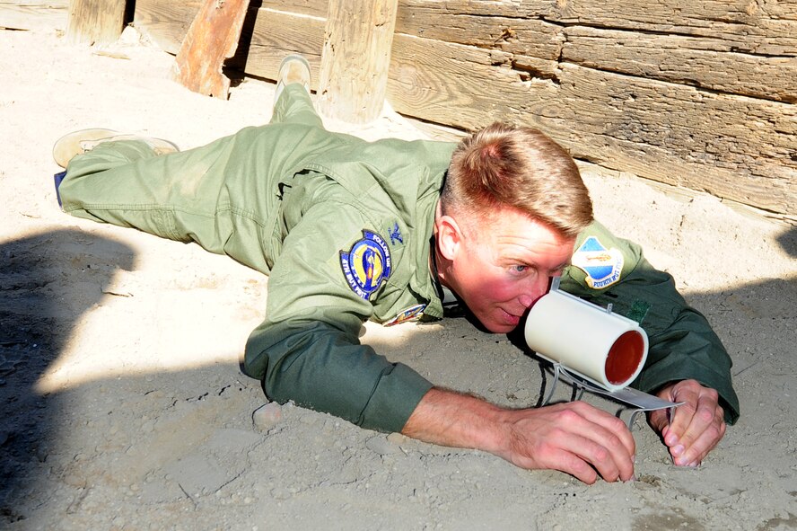 Colonel Patrick Doherty, 4th Fighter Wing commander, aims a MK-24 on the Explosive Ordnance Disposal flight’s firing range at Seymour Johnson Air Force Base, N.C., Oct. 25, 2011. The MK-24 is a explosive remote opening device used to remove the base plate and fuse from larger munitions. Doherty is a native of Lincoln, Neb. (U.S. Air Force photo by Senior Airman Rae Perry) 