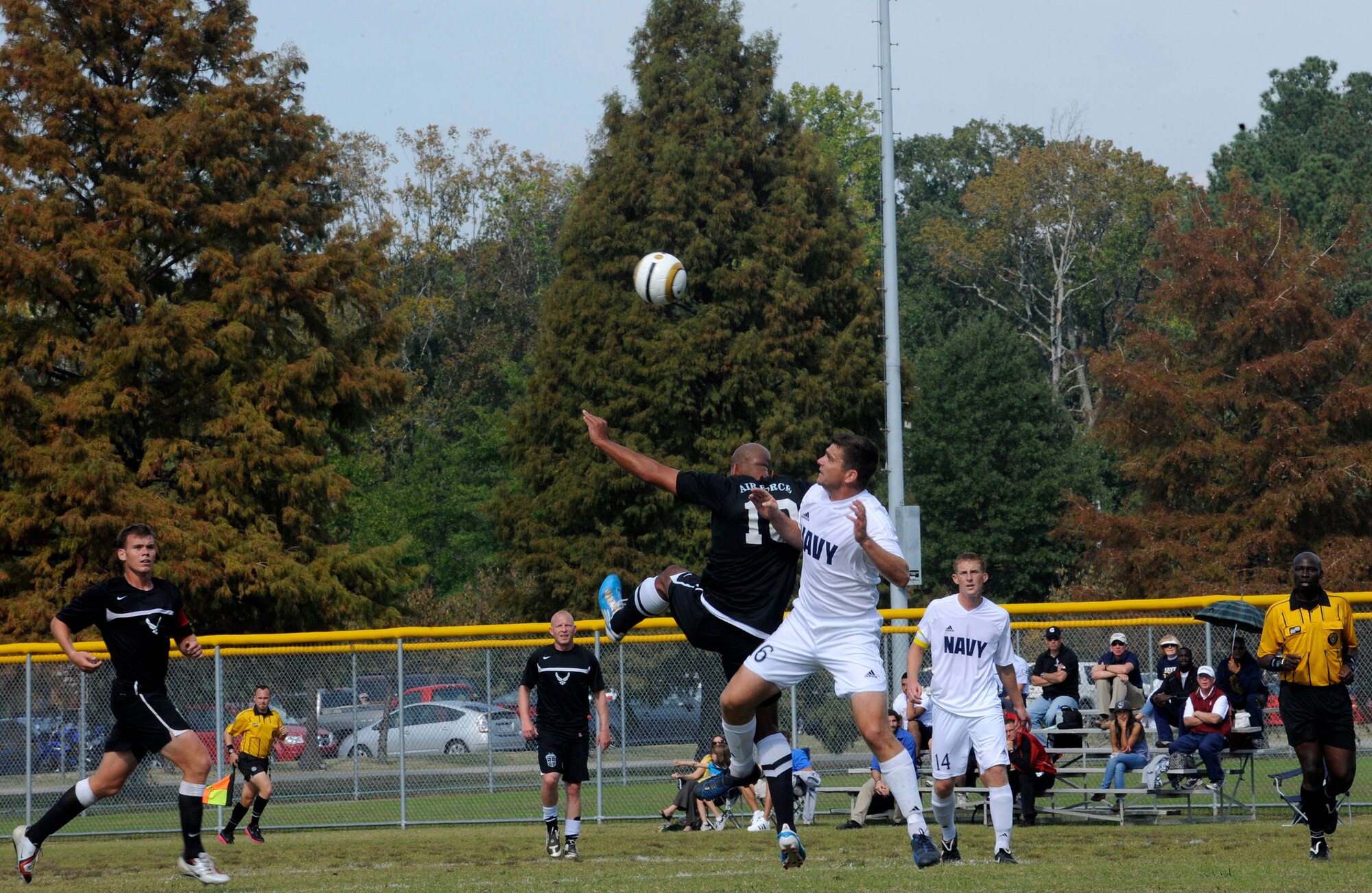 Members of the All-Air Force and Navy Men’s Soccer Teams fight it out during the Armed Forces Soccer Championship Tournament game at Fort Eustis Monday.  The tournament gave the teams a chance to showcase their talents while competing against other services. The Air Force won the championship, defeating the Navy 1-0. (U.S.Air Force photo by Staff Sgt. Dana Hill/RELEASED)