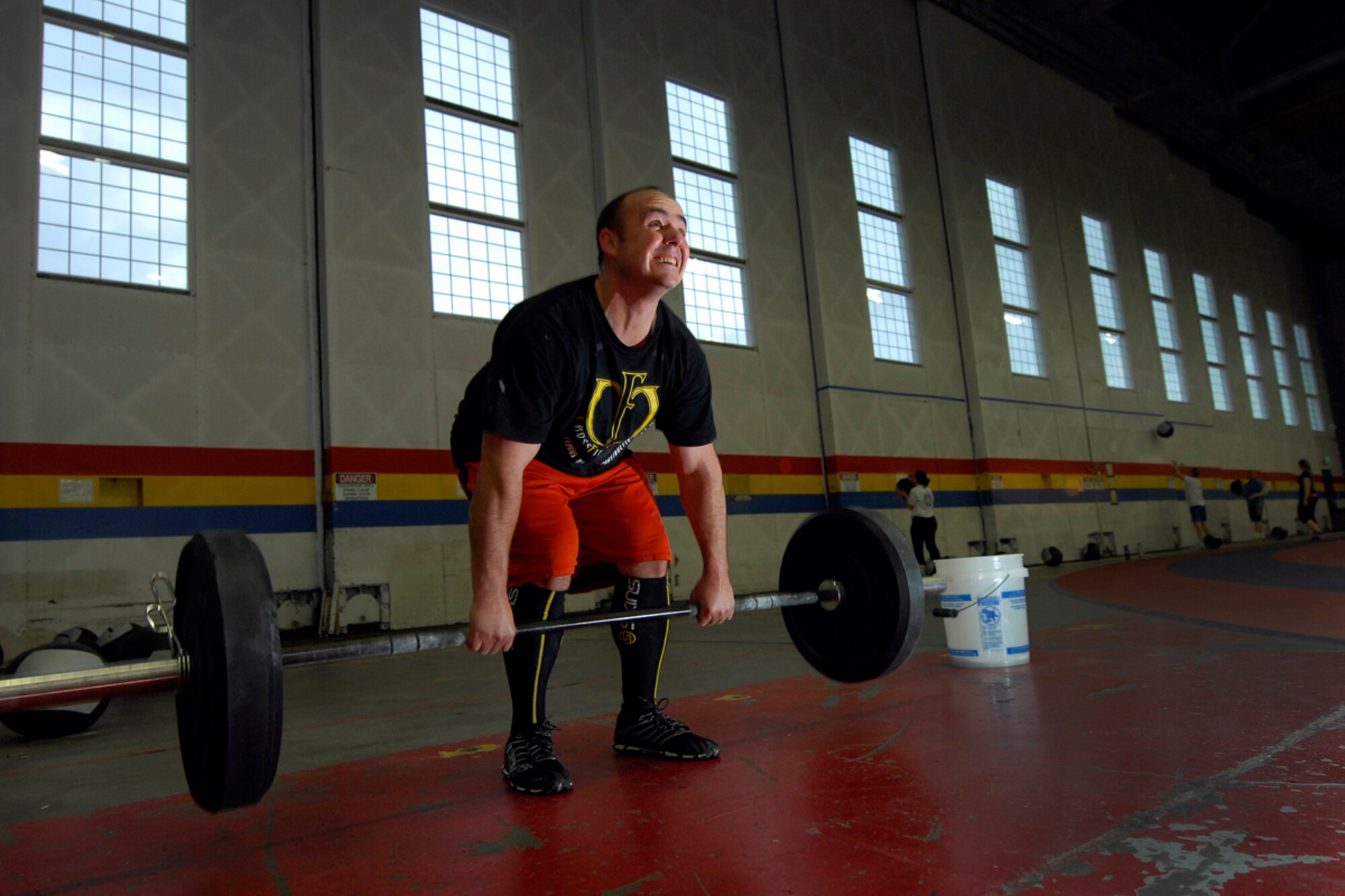 Tech. Sgt. Clifton Somers performs cleans and presses during a CrossFit workout at Hanger 5 Fitness Center on Joint Base Elmendorf-Richardson, Alaska, Oct. 25. Somers has lost 20 pounds in the last three months doing CrossFit.  He is assigned to the 673d Medical Group. (U.S. Air Force photo/Staff Sgt. Brian Ferguson)