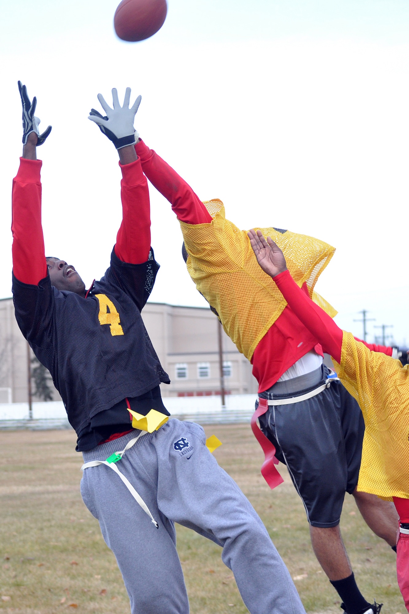 Victor Robinson grabs a touchdown pass for the 56th Engineer Company in the corner of the end zone over defenders from the 95th Chemical Company Saturday at the Buckner Physical Fitness Center field. The engineers stopped 95th Chem 23-14. (U.S. Air Force photo/John Pennell)