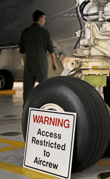 A 509th Bomb Wing pilot performs pre-flight inspections on the B-2 Spirit prior to his flight during Global Thunder 12 here Oct. 25. The rapid launch training is designed to exercise all mission areas. It provides training opportunities for component, task force, unit, forces and command posts to deter, and if necessary defeat, military attack against the United States and to employ forces as directed by the president. (U.S. Air Force photo by Staff Sgt. Alexandra M. Boutte) (RELEASED)