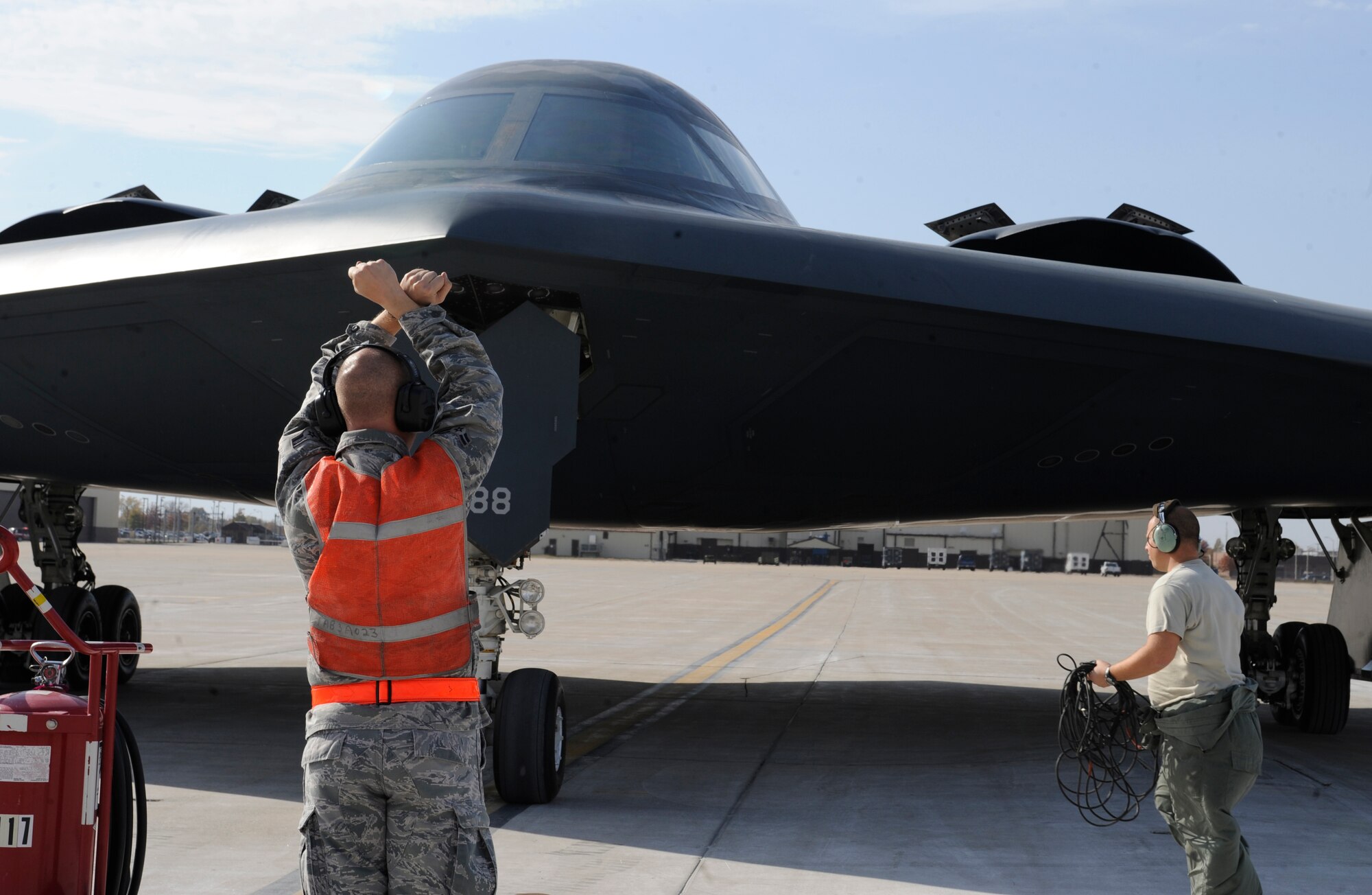 A member of the 509th Aircraft Maintenance Squadron taxis a B-2 Spirit for parking during Global Thunder 12 here Oct. 25. USSTRATCOM Field Training Exercise and Battle Staff Exercise are designed to exercise all mission areas with primary emphasis on Command and Control. (U.S. Air Force photo/Staff Sgt. Alexandra M. Boutte) (RELEASED)