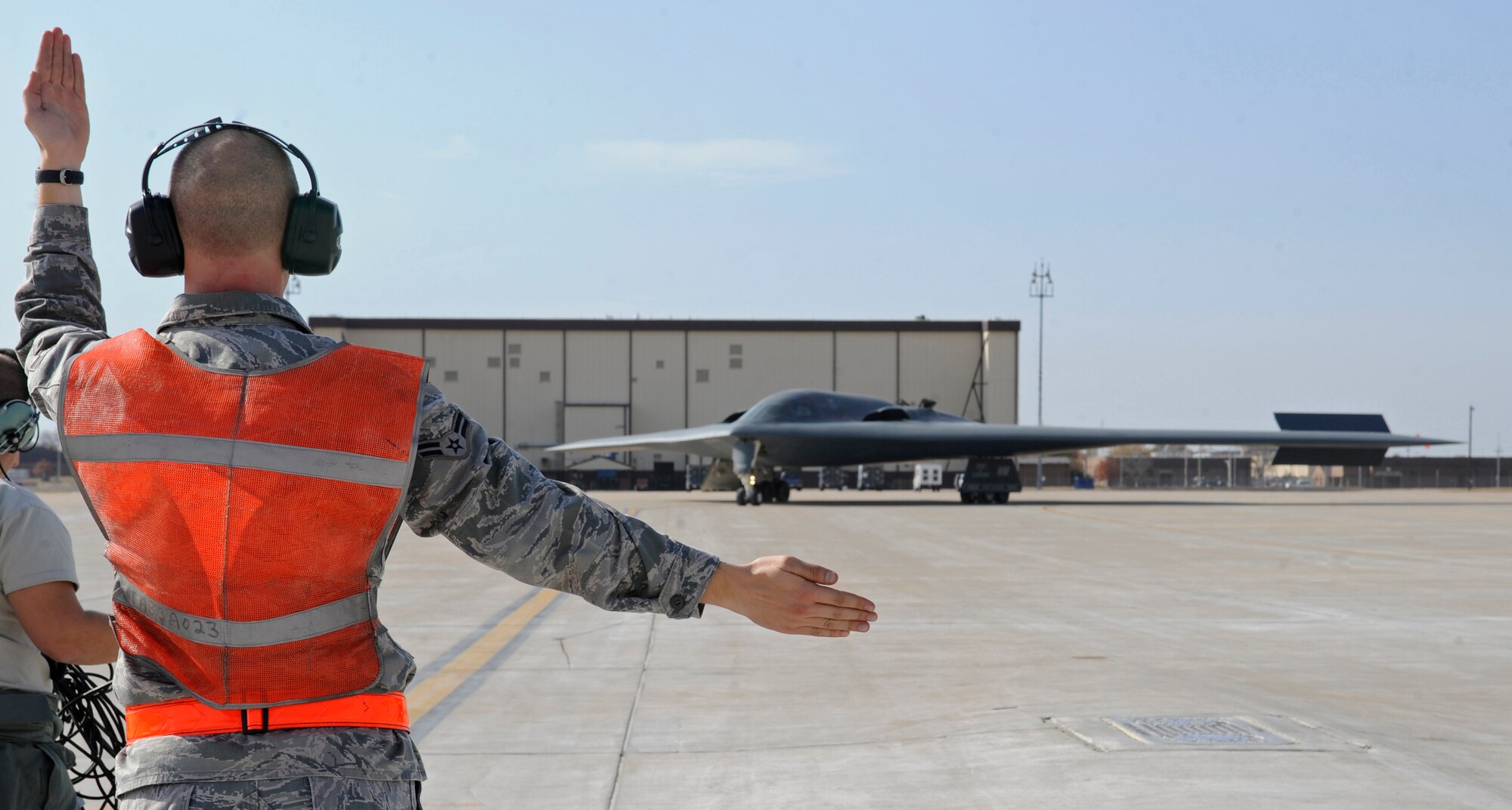 A member of the 509th Aircraft Maintenance Squadron taxis a B-2 Spirit for parking during Global Thunder 12 here Oct. 25. USSTRATCOM Field Training Exercise and Battle Staff Exercise are designed to exercise all mission areas with primary emphasis on Command and Control. (U.S. Air Force photo/Staff Sgt. Alexandra M. Boutte) (RELEASED)