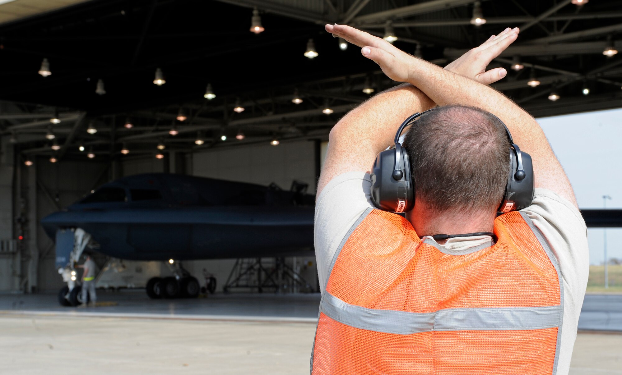 A crew chief of the 509th Aircraft Maintenance Squadron prepares to taxi the B-2 Spirit during Global Thunder 12 here Oct. 25. The rapid launch training is designed to exercise all mission areas. It provides training opportunities for component, task force, unit, forces and command posts to deter, and if necessary defeat, military attack against the United States and to employ forces as directed by the president. (U.S. Air Force photo/Staff Sgt. Alexandra M. Boutte) (RELEASED)