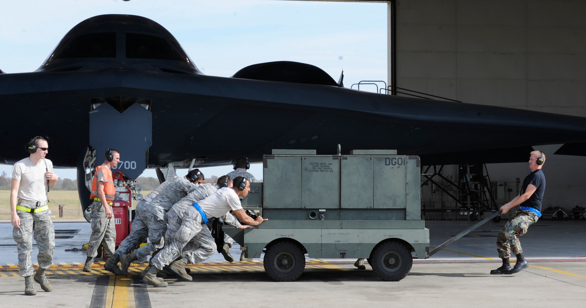 Maintainers and crew chiefs of 509th Bomb Wing hustle during Global Thunder 12 here Oct. 25. Several base agencies, from operations to maintenance support, participated in the exercise that provided training opportunities for USSTRATCOM joint enablers.  (U.S. Air Force photo/Staff Sgt. Alexandra M. Boutte) (RELEASED)