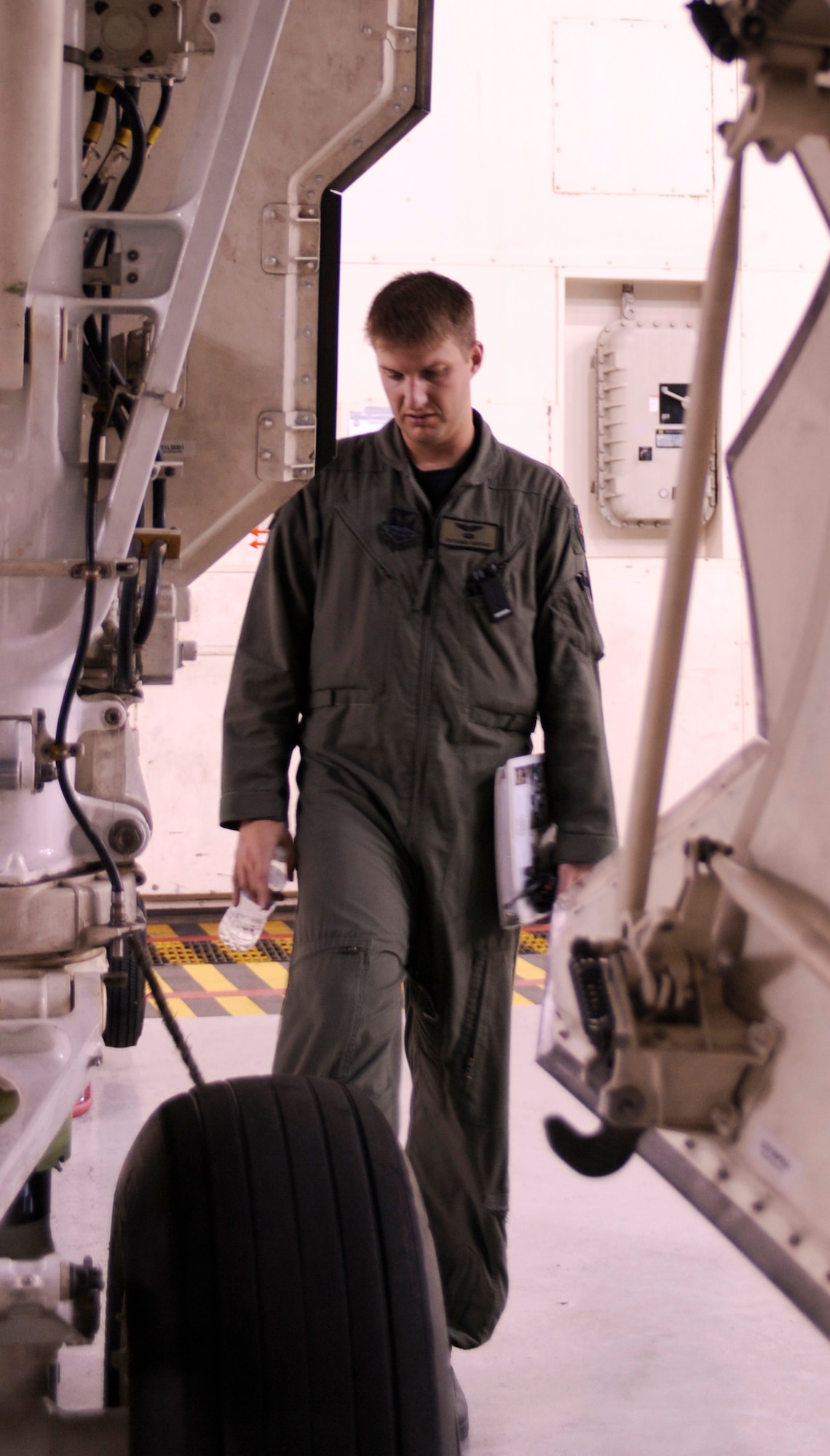 Major Richard Ganske, 13th Bomb Squadron pilot, performs pre-flight inspections on the B-2 Spirit prior to his flight during Global Thunder 12 here Oct. 25. The rapid launch training is designed to exercise all mission areas. It provides training opportunities for component, task force, unit, forces and command posts to deter, and if necessary defeat, military attack against the United States and to employ forces as directed by the president. (U.S. Air Force photo/Staff Sgt. Alexandra M. Boutte) (RELEASED)