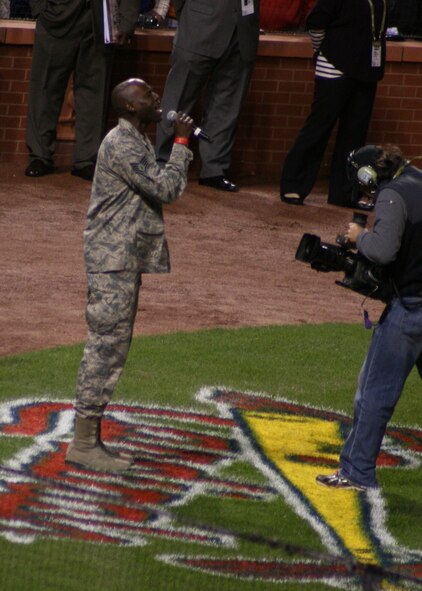 Staff Sgt. Brian Owens, of the 571st Air National Guard Band of the Central States,
sings "God Blesss America" during the 7th inning stretch of Game 1 of the 2011 World Series at Busch Stadium, Oct 19.  The 571st is based at the 131st Bomb Wing, Lambert Air National Guard Base, Saint.Louis.  (Photo by Matthew J. Wilson)
