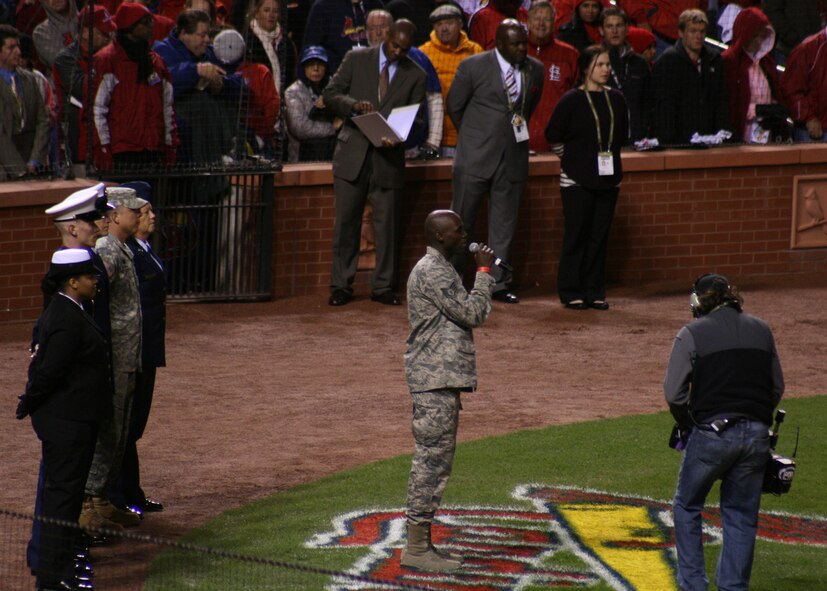 Staff Sgt. Brian Owens, of the 571st Air National Guard Band of the Central States,
sings "God Blesss America" during the 7th inning stretch of Game 1 of the 2011 World Series at Busch Stadium, Oct 19.  The 571st is based at the 131st Bomb Wing, Lambert Air National Guard Base, Saint.Louis.  (Photo by Matthew J. Wilson)

