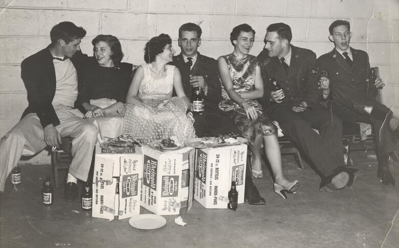 Airman 2nd Class Richard Staley (far right), socializes with fellow Airmen from the 512th Troop Carrier Wing Medium during a wing dining-in, known as a "wing ding," circa 1956. Staley joined the Air Force Reserve unit, then located in New Castle, Del., in 1954, seven years after the Air Force became a separate service. (Courtesy photo)
