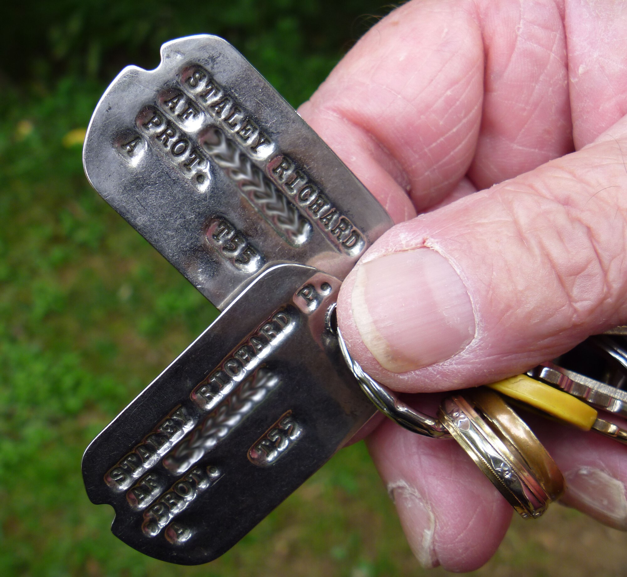 Nearly 50 years after serving as a reservist in the 512th Troop Carrier Wing Medium, Richard Staley still carries his dog tags on his key ring. Dog tags from his service era, 1954 - 1962, included servicemembers' Air Force serial number and the year of their last tetanus shot. (U.S. Air Force photo/Master Sgt. Veronica Aceveda)