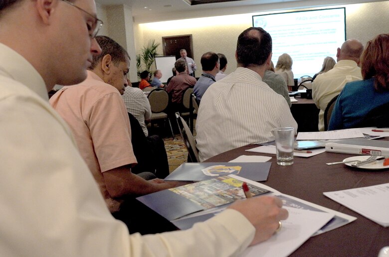 Mr. James Waclawczyk takes notes as presenter Mr. Val De La Fuente discusses Accelerated Site Cleanup cost benefit analysis Oct. 17, 2011 at the Base Closure and Realignment (BRAC) Symposium in San Antonio, Texas. 