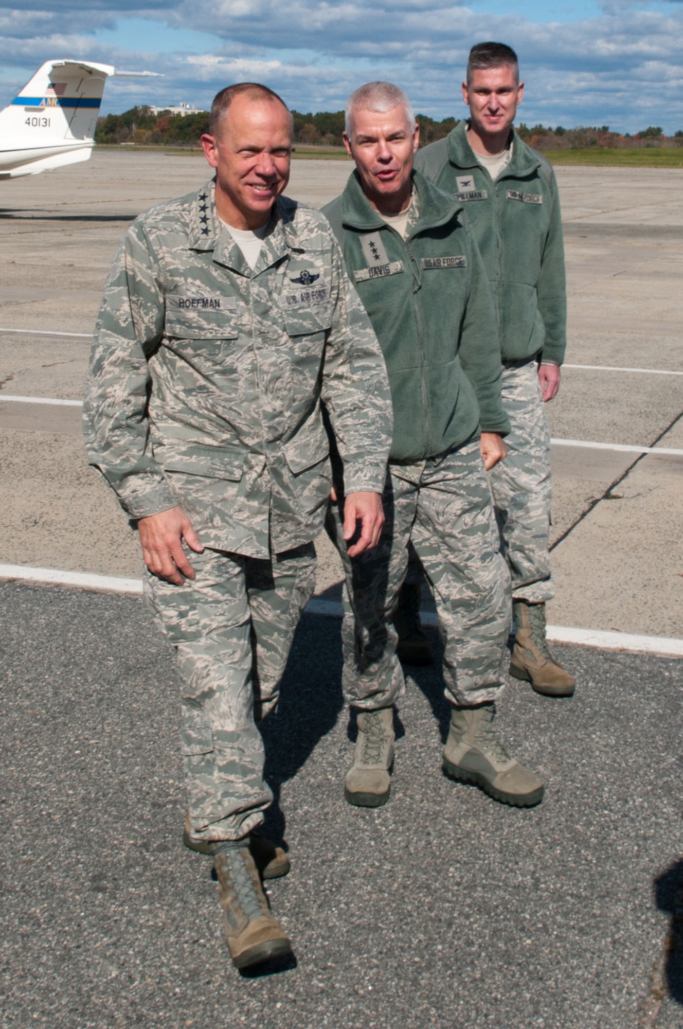 HANSCOM AIR FORCE BASE, Mass. – Lt. Gen. Charles R. Davis (middle), Electronic Systems Center commander, and Col. Mark Spillman, ESC vice commander, accompany Gen. Donald Hoffman (left), Air Force Materiel Command commander, from the flight line Oct. 25. General Hoffman visited Hanscom for the fall program reviews and also had an opportunity to receive updates on key ESC programs. (U.S. Air Force photo by Rick Berry)