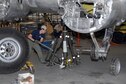 DAYTON, Ohio (10/2011) -- Restoration specialists at the National Museum of the U.S. Air Force extend the landing gear on the Boeing B-17F &quot;Memphis Belle.&quot; (U.S. Air Force photo by Ben Strasser)