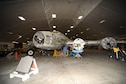 DAYTON, Ohio (10/2011) -- Restoration specialists at the National Museum of the U.S. Air Force mate the left wing to the Boeing B-17F &quot;Memphis Belle.&quot; (U.S. Air Force photo by Ben Strasser)