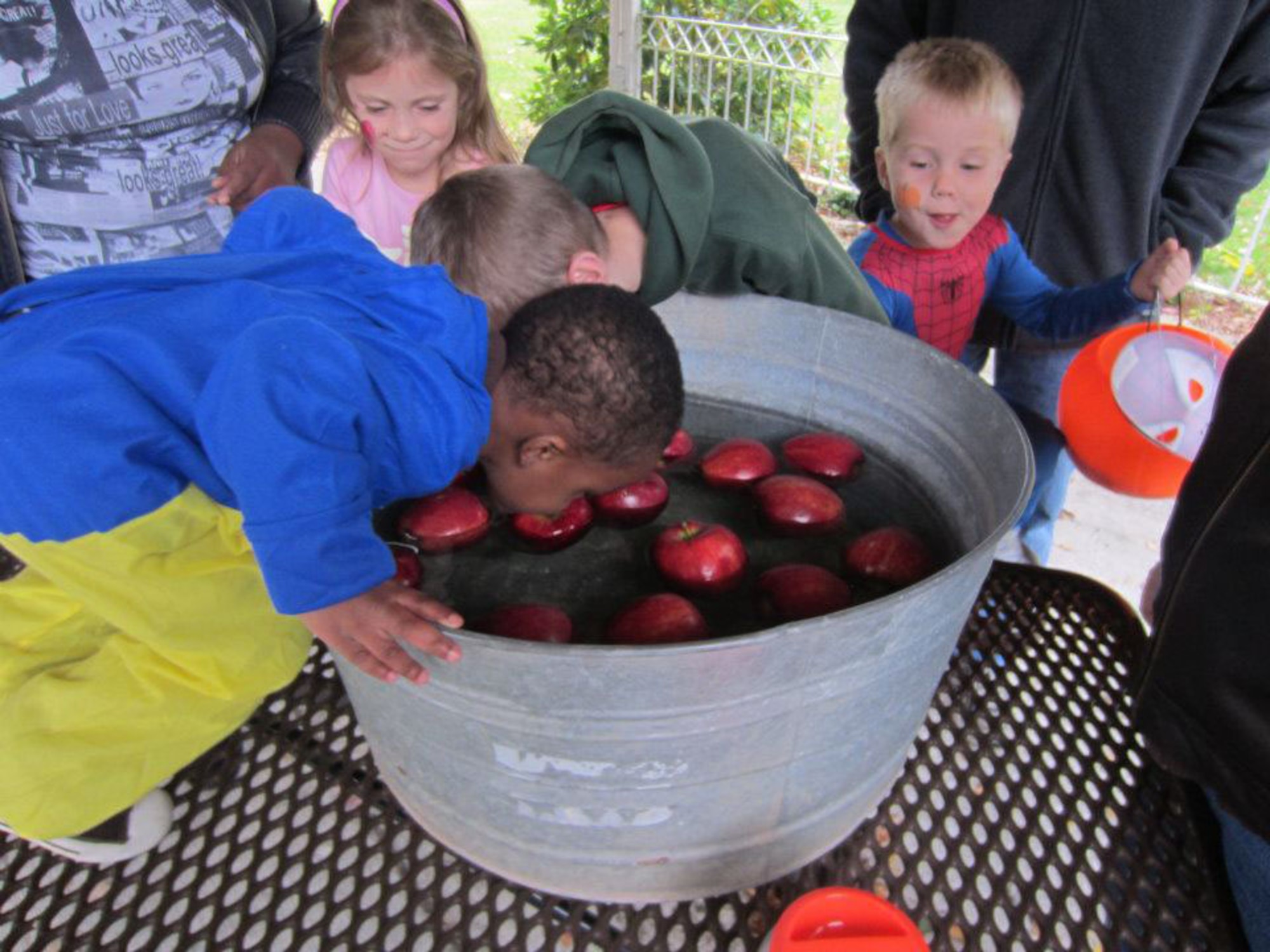 HANSCOM AIR FORCE BASE, Mass. – Kids line up to bob for apples during the Trunk or Treat and Fall Festival at the chapel Oct. 23. (Courtesy photo)