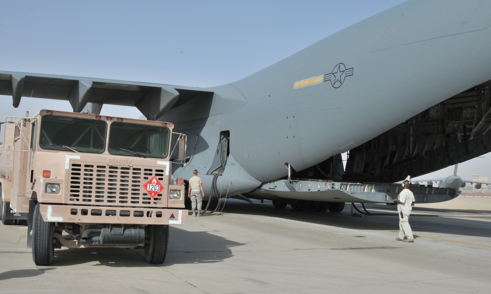 A fuel truck receives aviation gasoline from fuel bladders inside a C-17 Globemaster III Oct. 21, 2011, at an undisclosed location in Southwest Asia. Members from the 379th Expeditionary Logistics Readiness Squadron aerial bulk fuel delivery system transport fuels to different locations throughout the area of responsibility to help maintain mission capabilities. (U.S. Air Force photo/Senior Airman Eric Summers Jr.)
