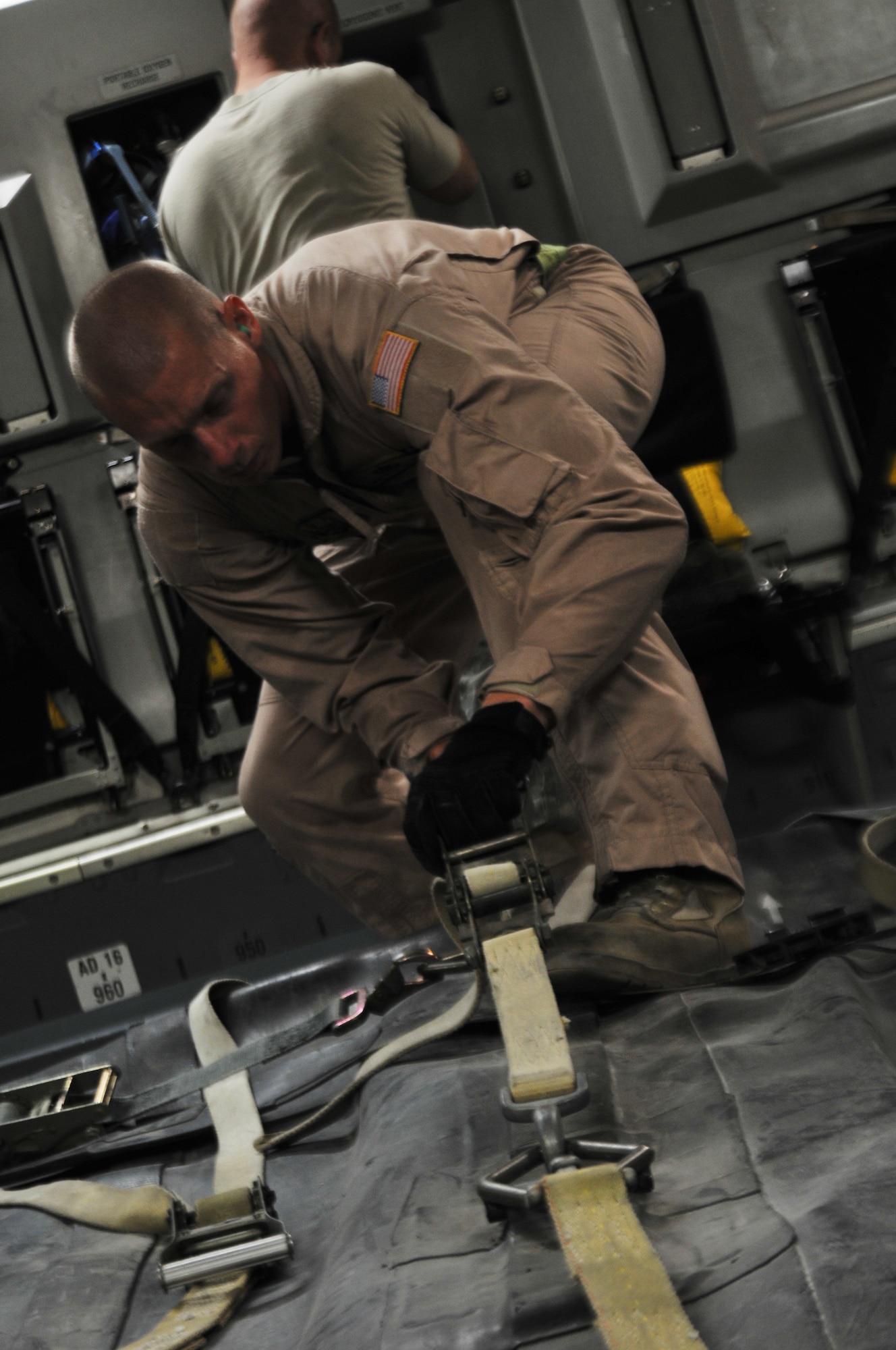 Staff Sgt. Michael Furlough, 379th Expeditionary Logistics Readiness Squadron aerial bulk fuel delivery system team member, loosens straps on a fuel bladder as he prepares to fill the bladder with aviation gasoline Oct. 20, 2011, at an undisclosed location in Southwest Asia. The fuel bladders are used to transport various fuels to bases throughout the area of responsibility. Furlough, a native of White House, Tenn., is deployed from Joint Base McGuire-Dix- Lakehurst, N.J. (U.S. Air Force photo/Senior Airman Eric Summers Jr.) 