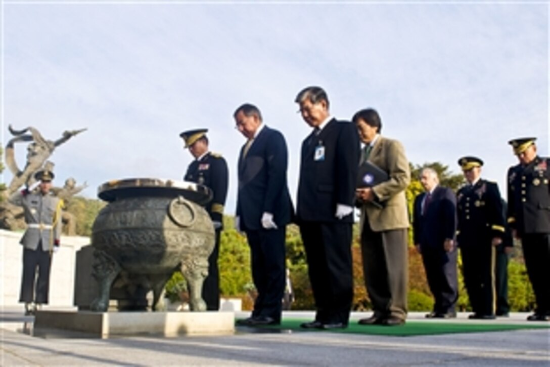 U.S. Defense Secretary Leon E. Panetta and military leaders observe a moment of silence at Seoul National Cemetery in Seoul, South Korea, Oct. 27, 2011. 
