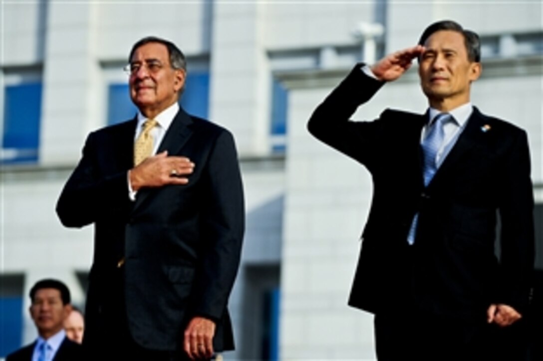 U.S. Defense Secretary Leon E. Panetta, left, and South Korean Defense Minister Kim Kwan-jin stand together during an honor guard ceremony in Seoul, South Korea, Oct. 27, 2011.