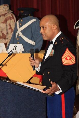 Master Gunnery Sgt. Clinton I. Taylor, event guest speaker, gives some motivational words to a group of little warriors during the first Mini Marine Corps Ball at the Club Iwakuni Ballroom, Oct. 27.