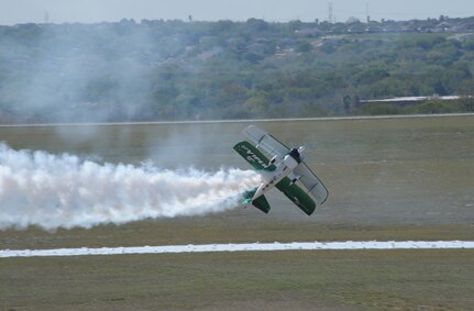 Jason Newburg performes a low-level acrobatic maneuver in a modified Pitts S2S Viper Oct. 28 in support of the 2011 Randolph Air Force Base Airshow practice. . (U.S. Air Force photo/Joel Martinez) (released)