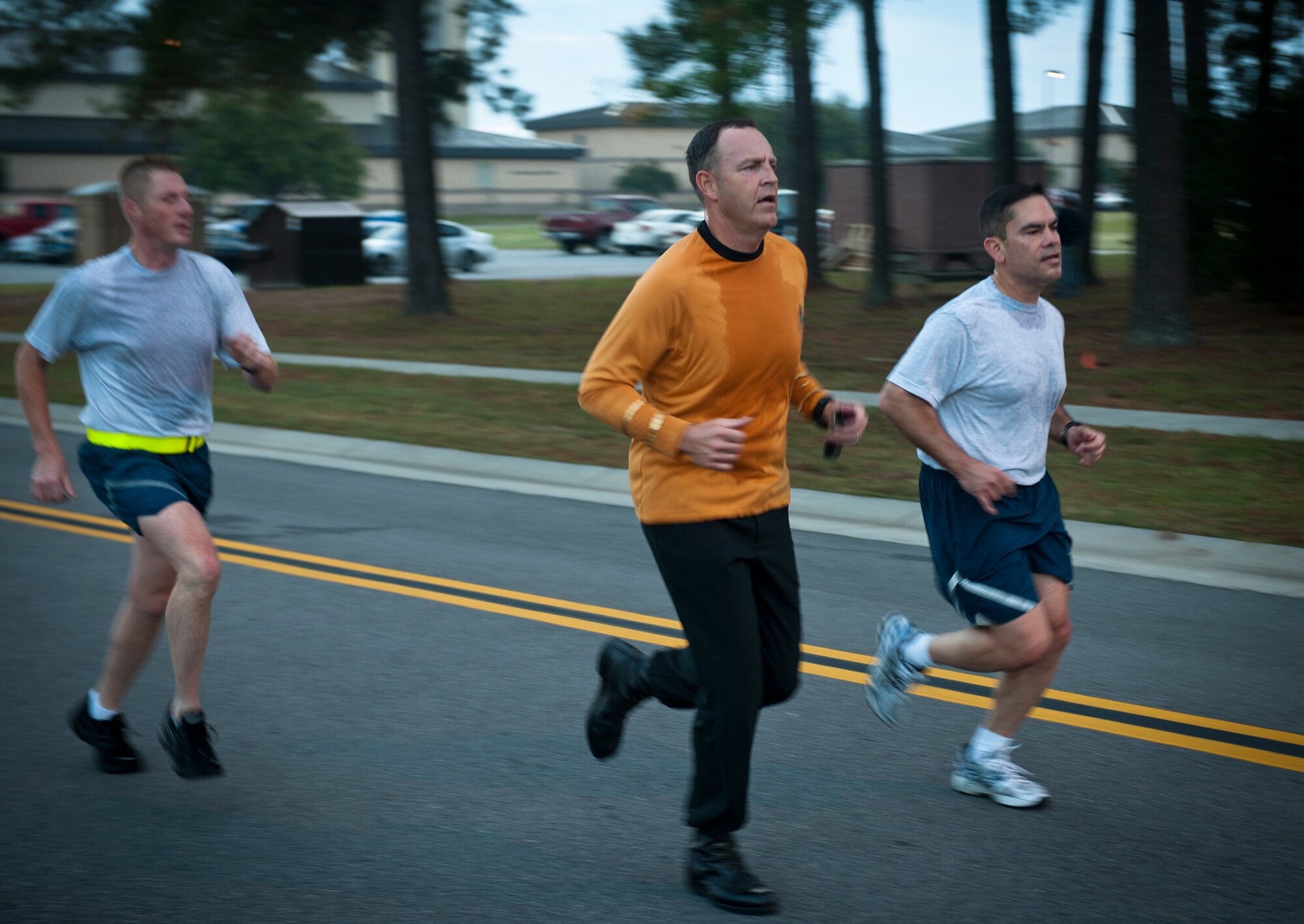 U.S. Air Force Col. Christopher Short, 23rd Wing vice commander, center, runs toward the finish line wearing a Star Trek costume during the Scary Pumpkin 5K run at Moody Air Force Base, Ga., Oct. 28, 2011. With the option to wear costumes during the event, the Scary Pumpkin run was a way to add a fun and humorous approach to a physical training session while celebrating Halloween. (U.S. Air Force photo by Airman 1st Class Joshua Green/Released)             
