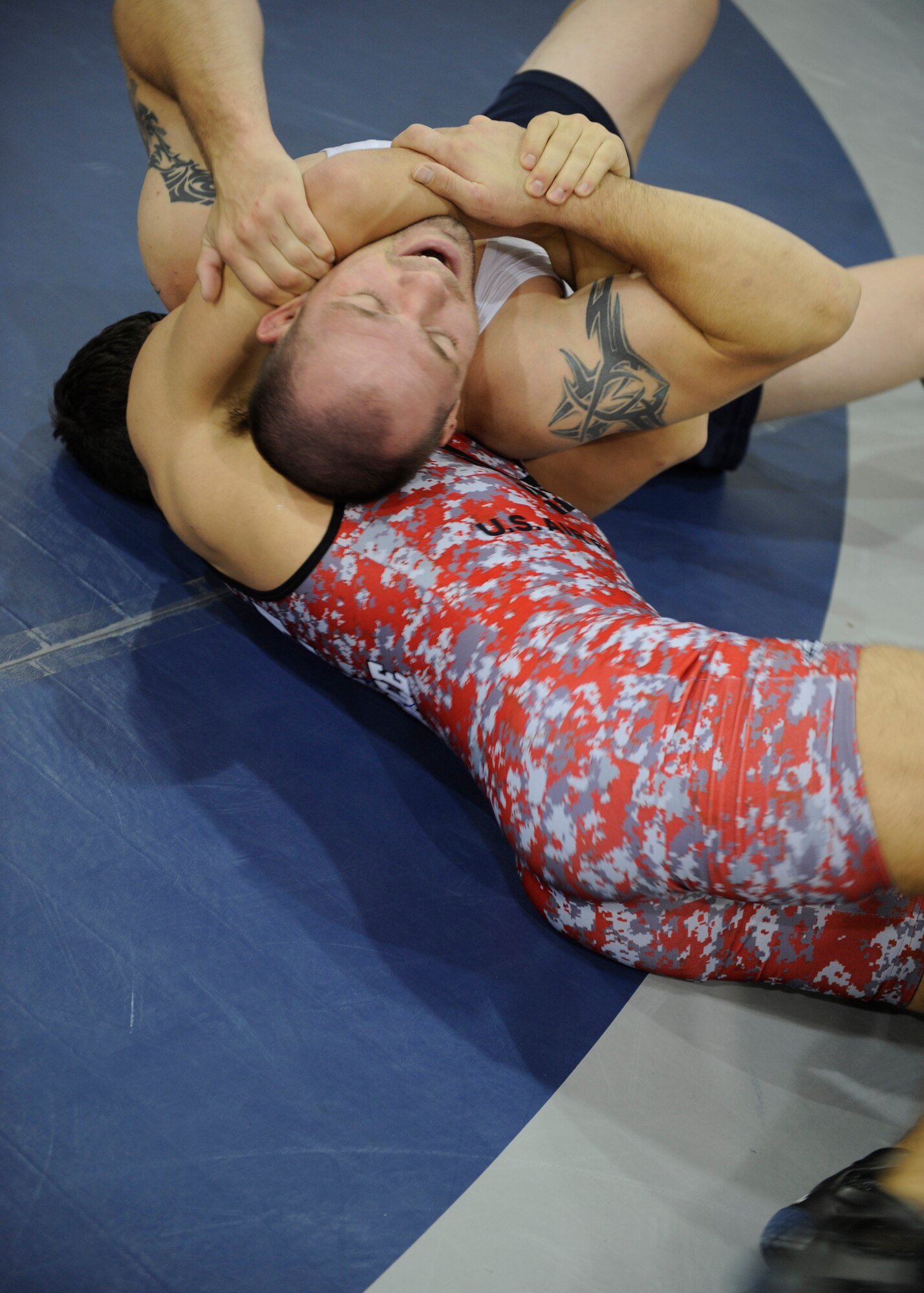 Senior Airmen Jeff Zastrow and Sam West practice grappling techniques, Oct. 27, 2011, at Mountain Home Air Force Base, Idaho. Zastrow is a four-year veteran of the All-Air Force wrestling team and is stationed with the 10th Aerospace Medical Squadron at U.S. Air Force Academy Colo. West is stationed with the 46th Maintenance Squadron at Eglin AFB, Fla. (U.S. Air Force photo by Airman Shane M. Phipps)