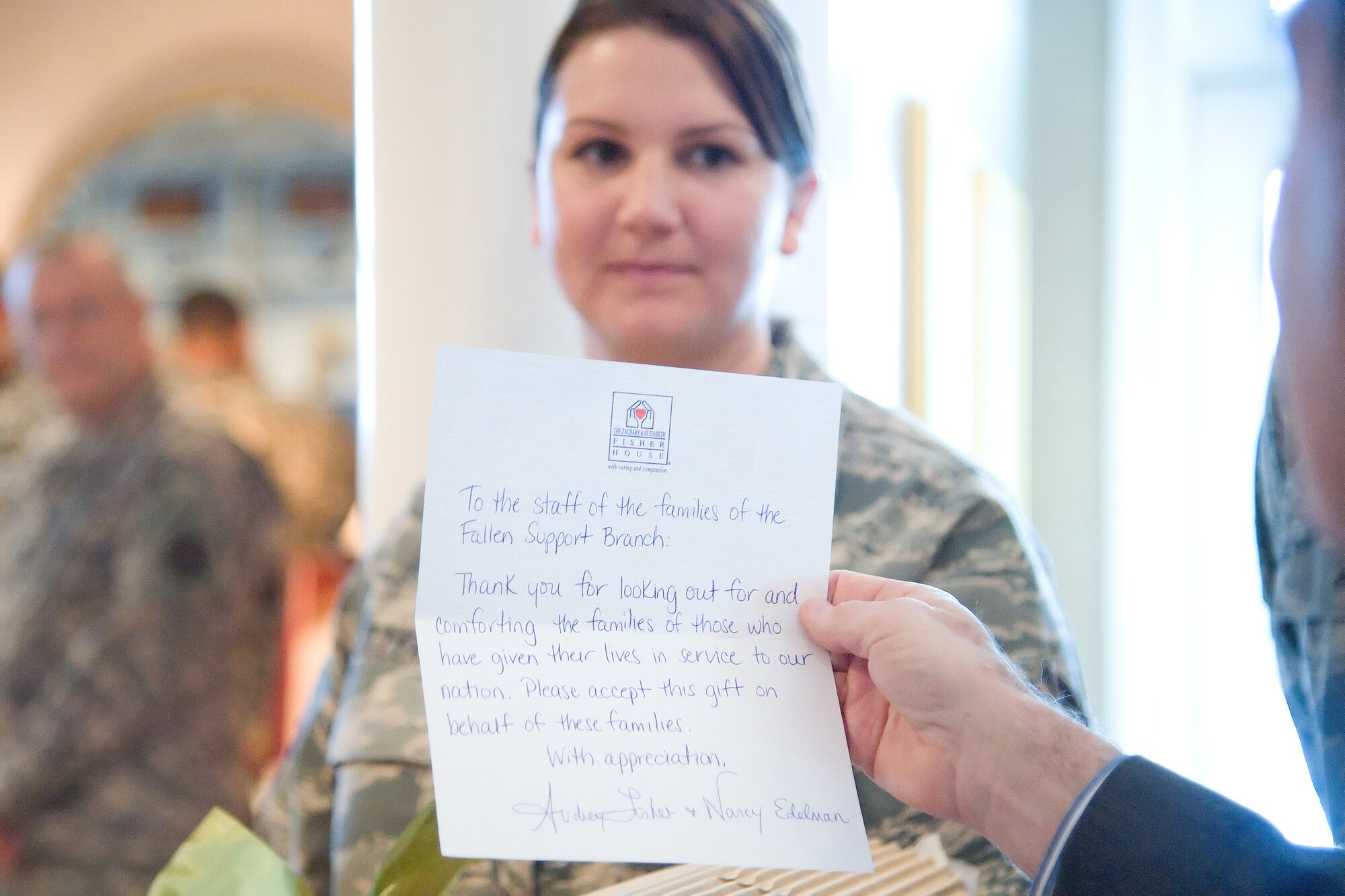 Jim Weiskopf, Fisher House Foundation vice president, reads a thank you letter from Fisher House Foundation Board of Trustees Vice Chairmen Audrey Fisher and Nancy Edelman to the staff at the Fisher House for Families of the Fallen Oct. 28, 2011. (U.S. Air Force photo/Adrian R. Rowan)
