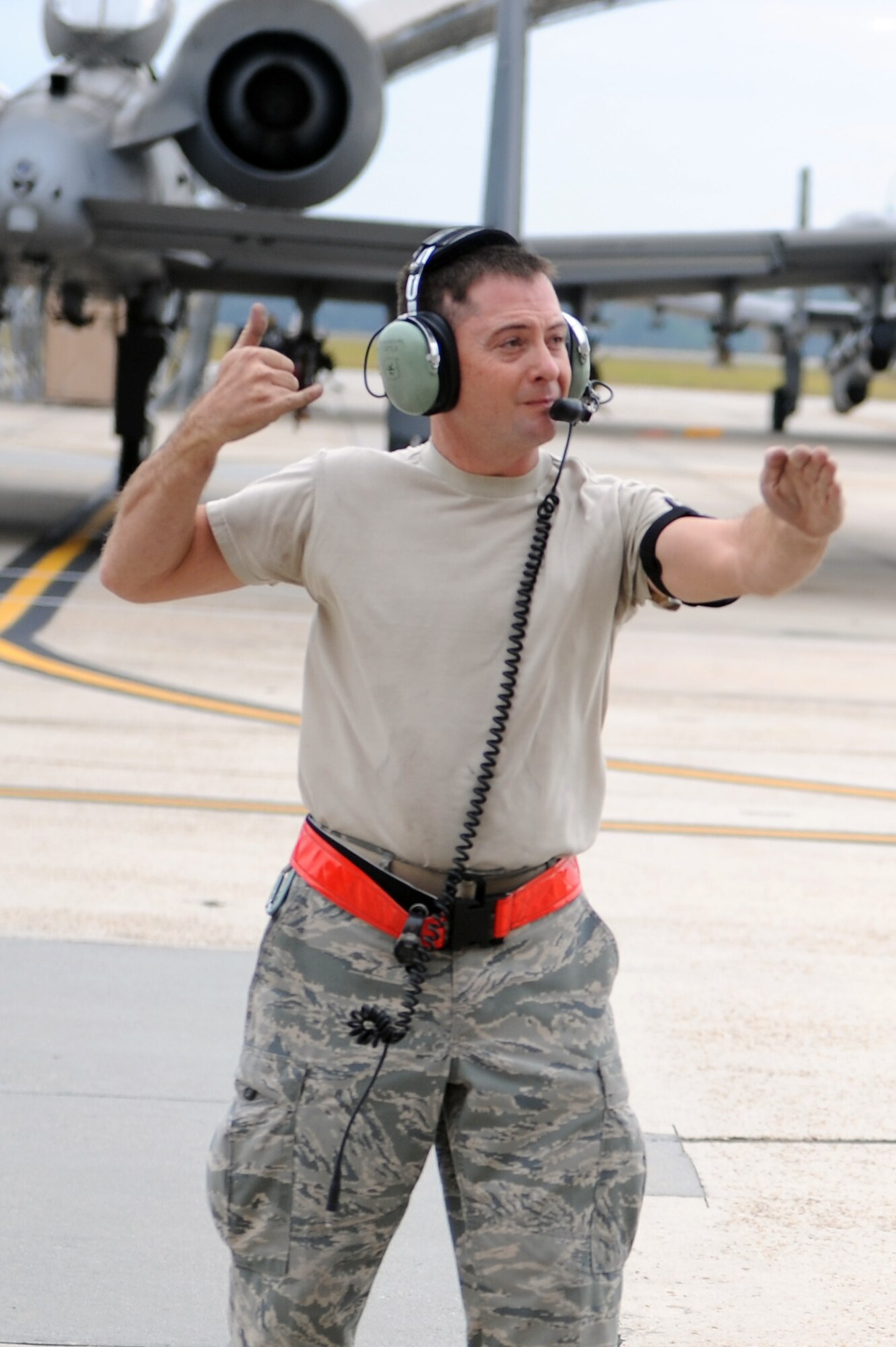U.S. Air Force Staff Sgt. Michael Mindziak, 476th Maintenance Squadron crew chief, gives direction via hand signals to an A-10C Thunderbolt II pilot, during a preflight inspection at Moody Air Force Base, Ga., Oct. 27, 2011. During the inspection Mindziak uses hand signals to communicate with the pilot when audio capability is unavailable. Crew chiefs and pilots work together during preflight inspections to ensure the aircraft is ready for takeoff. (U.S. Air Force photo by Senior Airman Ciara Wymbs/Released)