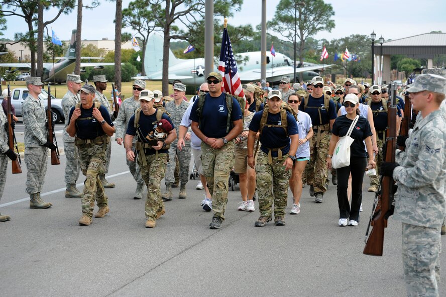 Friends, family and co-workers show support while marching alongside 18 Special Tactics Airmen as they complete an 812-mile memorial march from Lackland Air Force Base, Texas, to Hurlburt Field, Fla. The Tim Davis Memorial March is conducted each year that a Special Tactics Airman loses his life in defense of his country. (U.S. Air Force photo/Master Sgt. Steven Pearsall) (RELEASED)