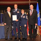 WRIGHT-PATTERSON AIR FORCE BASE, Ohio – Congressman David Hobson, former U.S. Representative for Ohio's 7th District, presents Col. Stephen Goeman, 445th Airlift Wing commander and Chief Master Sgt. Peri Rogowski, 445 AW command chief, the U.S. House of Representatives Proclamation during the Miami Valley Military Affairs Association 31st Annual Membership Dinner Oct. 19, while Woody Stroud, 2010 award recipient and MVMAA past president looks on. (U.S. Air Force photo/Bill Richard)