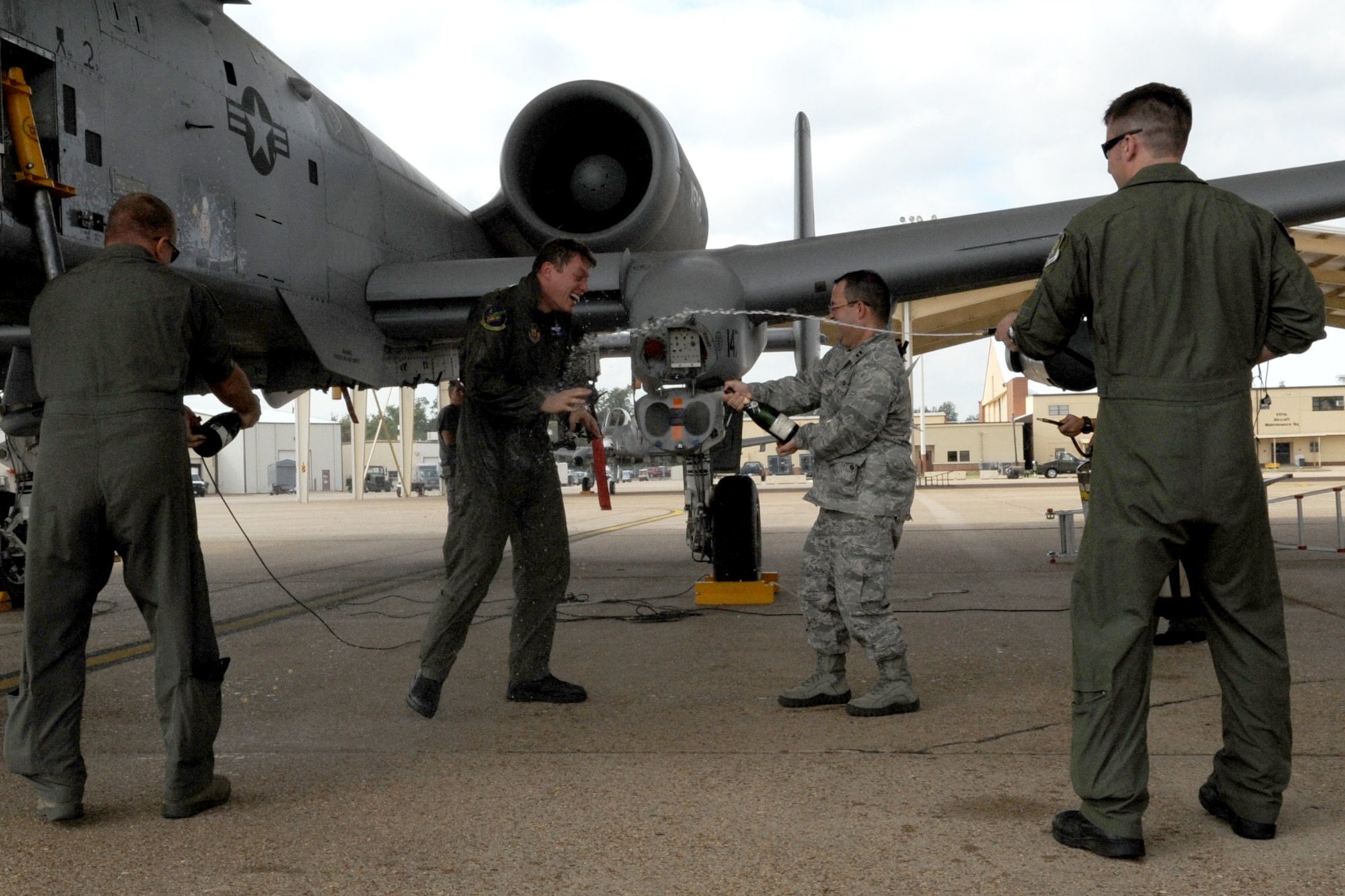 U.S. Air Force Lt. Col. Mitch Hanson, 47th Fighter Squadron director of operations, is sprayed down after returning from a sortie at Barksdale Air Force Base, La., Oct. 26, 2011. Hanson flies the A-10 Thunderbolt II aircraft and this mission marked his last flight with the squadron. (U.S. Air Force photo by Master Sgt. Greg Steele/Released)