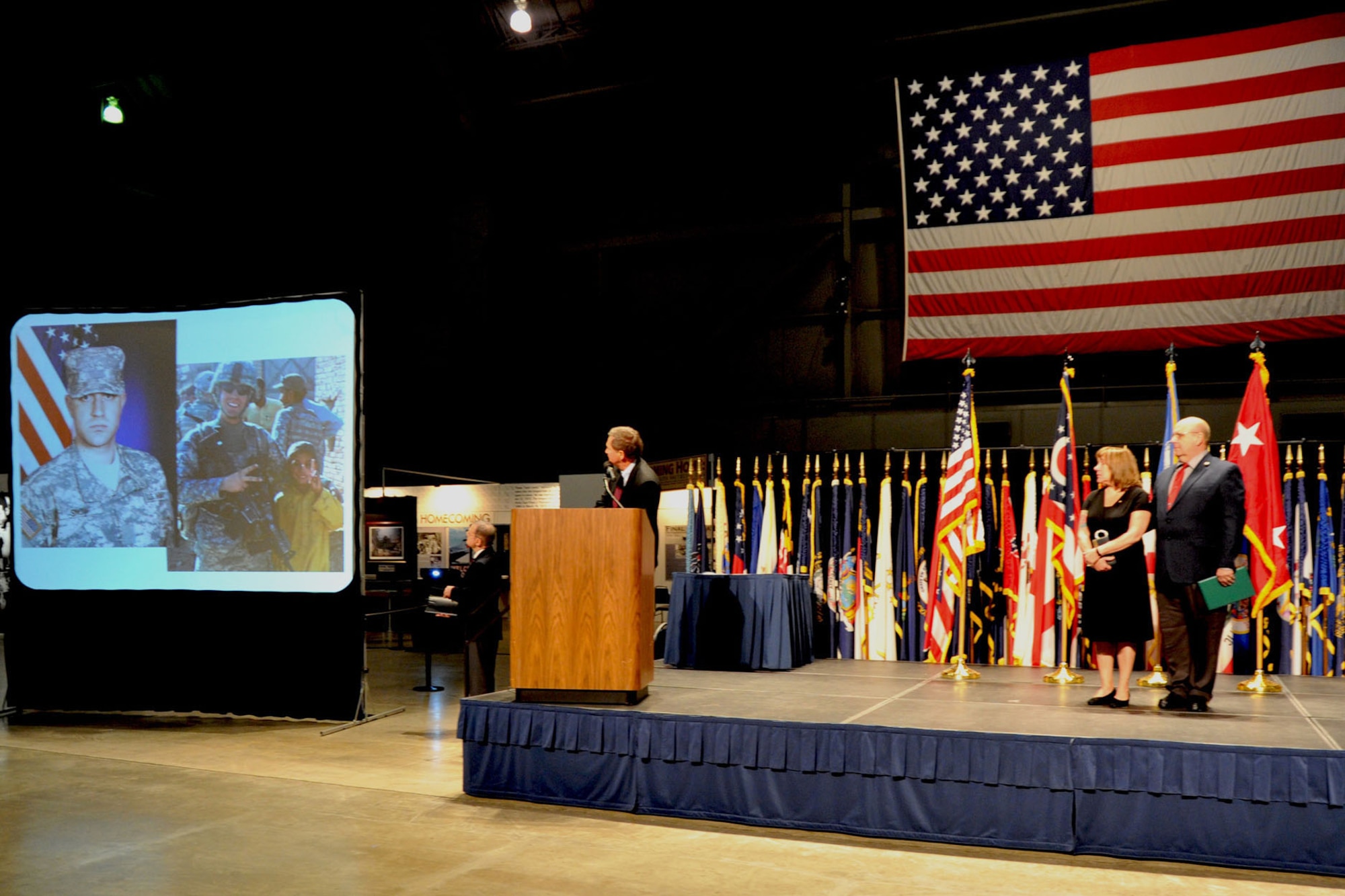 DAYTON, Ohio -- Ohio Governor John Kasich admires a photo of Army Specialist Jesse Adam Snow of the 101st Airborne Division during a ceremony to posthumously present the Silver Star Award to Snow at the National Museum of the U.S. Air Force. Snow was a native of Fairborn, Ohio.  (U.S. Air Force Photo)