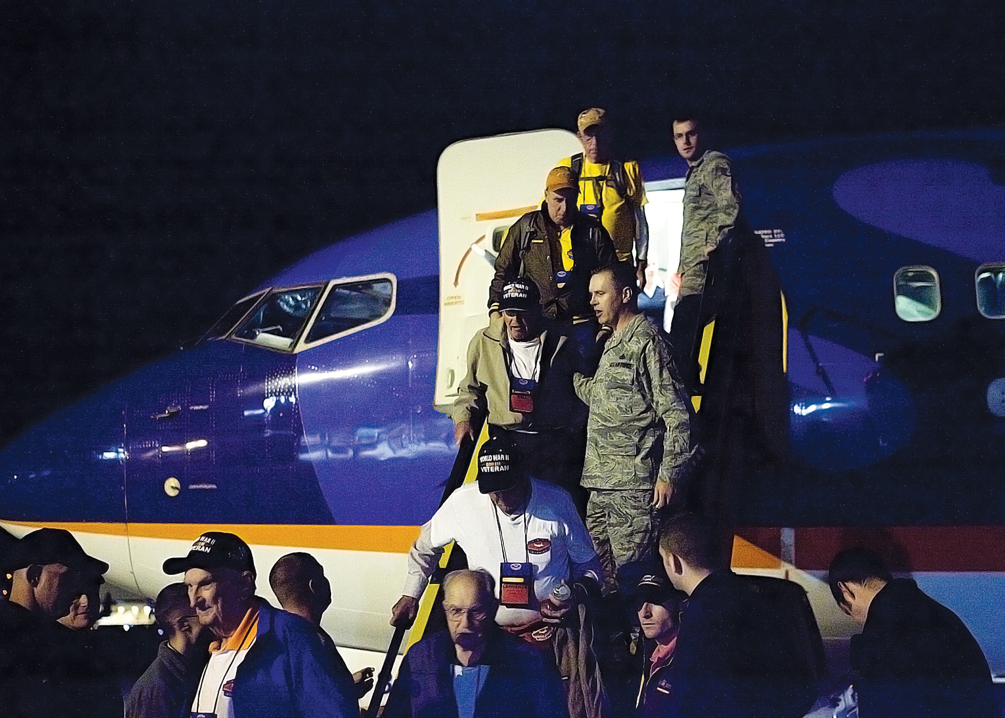 Airmen from F. E. Warren Air Force Base assist veterans departing a plane upon returning from their trip to Washington D.C. Oct. 12. (U.S. Air Force photo by Matt Bilden)