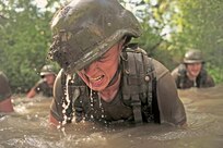 An Airman lifts his head out of the water while conducting exercises during the Air Force Pararescuemen Indoctrination Course, Sept. 6 at Lackland. During the training, Airmen simulate missions which could involve air, ground and water survival.  Airmen must complete 80-weeks of specialized training in addition to basic military training to become pararescuemen. (U.S. Air Force photo/Staff Sgt. Vernon Young Jr.)