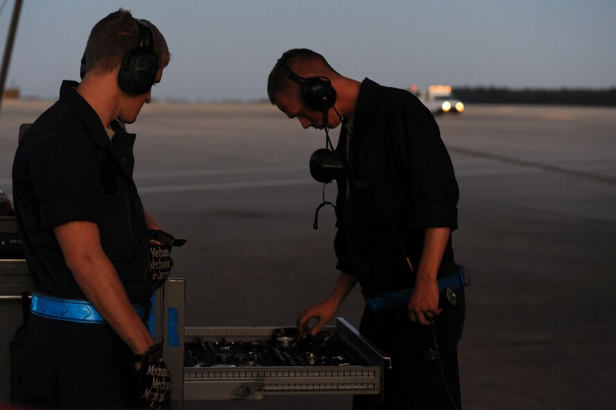 Senior Airmen Cory Bryant and Trever Diimmel account for all tools before launching a jet on Seymour Johnson Air Force Base, N.C., Oct. 25, 2011. Accountability of all tools prior to takeoff ensures the safety of aircrew and aircraft. Bryant and Diimmel are both 4th Aircraft Maintenance Squadron crew chiefs.  Bryant is a native of Seadrift, Texas and Diimmel hails from Auburn, Wash. (U.S. Air Force photo by Senior Airman Whitney Stanfield)