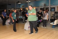 Professional Bowlers Association Hall of Fame member Norm Duke, left, observes Winford Webb’s technique before offering pointers during a PBA pro bowling exhibition and seminar at Saturday at the Skylark Bowling Center. More than 70 participants showed up at bowling center to mingle with Duke and fellow hall of famer Randy Pedersen. (U.S. Air Force photo/ Alan Boedeker)