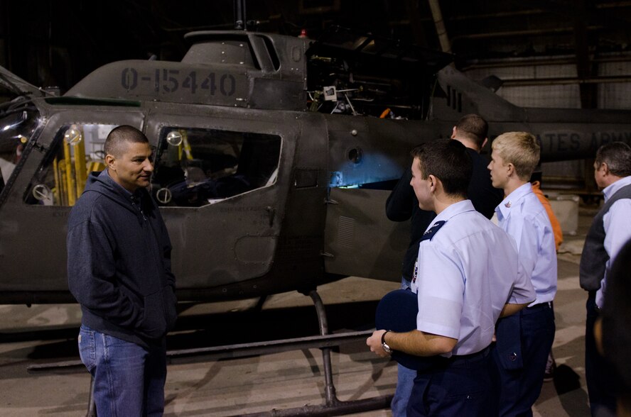 Chief Warrant Officer 2 Dominic Carello (left), counterdrug pilot for the Missouri National Guard, listens to a question from a Civil Air Patrol (CAP) cadet at Rosecrans Memorial Airport, St. Joseph, Mo., Oct. 27, 2011. The CAP cadets got a firsthand look at a Missouri Guard OH-58 Kiowa helicopter during their weekly meeting at Rosecrans. (U.S. Air Force photo by Staff Sgt. Michael Crane/Missouri Air National Guard)