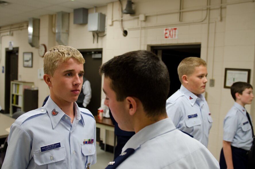 Lawton Huffman, Civil Air Patrol (CAP) cadet captain, inspects a cadet’s uniform during an open ranks inspection at Rosecrans Air National Guard Base, St. Joseph, Mo., Oct. 27, 2011. The CAP cadets meet at the base for their meetings. (U.S. Air Force photo by Staff Sgt. Michael Crane/Missouri Air National Guard)