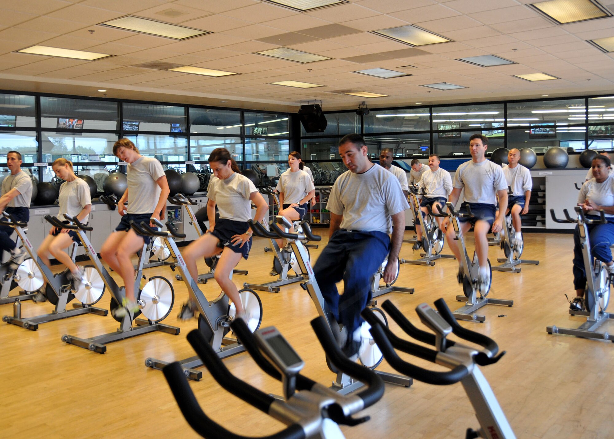 TRAVIS AIR FORCE BASE, Calif. -- 349th Air Mobility Wing staff members ‘in a spin class at the base gym. (U.S. Air Force photo/Master Sgt. Robert Wade)