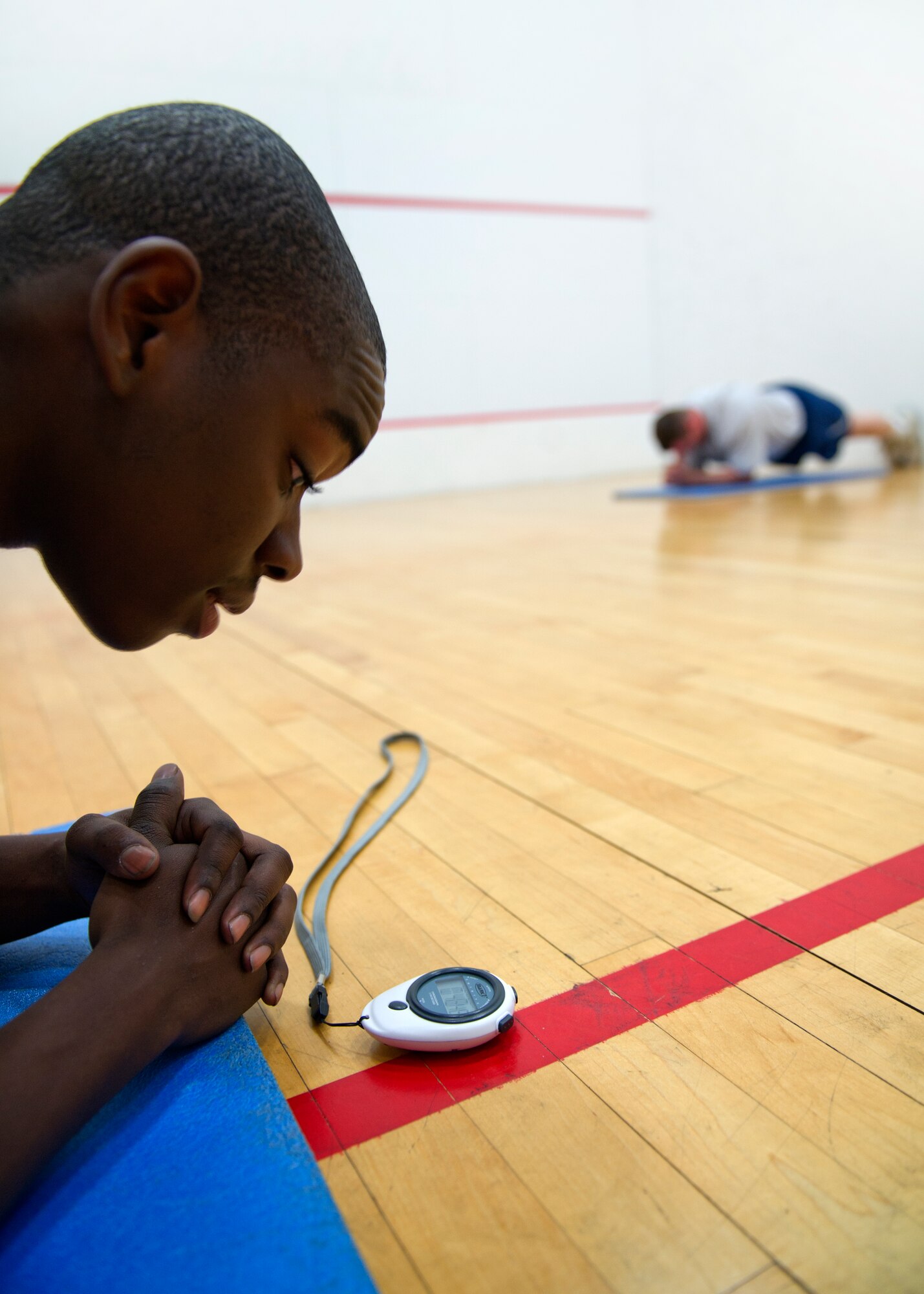 HOLLOMAN AIR FORCE BASE, N.M. -- U.S. Air Force Senior Airman Gregory Hart, a physical training leader with the 49th Aircraft Maintenance Squadron, checks the time during a physical improvement session Oct. 20, 2011, at the Domenici Fitness and Sports Center. Airmen from the 49th AMXS partake in a four-day-a-week fitness improvement program designed to increase passing scores on the physical assessment test in order to maintain mission readiness. (U.S. Air Force photo by Senior Airman Veronica Stamps/Released)