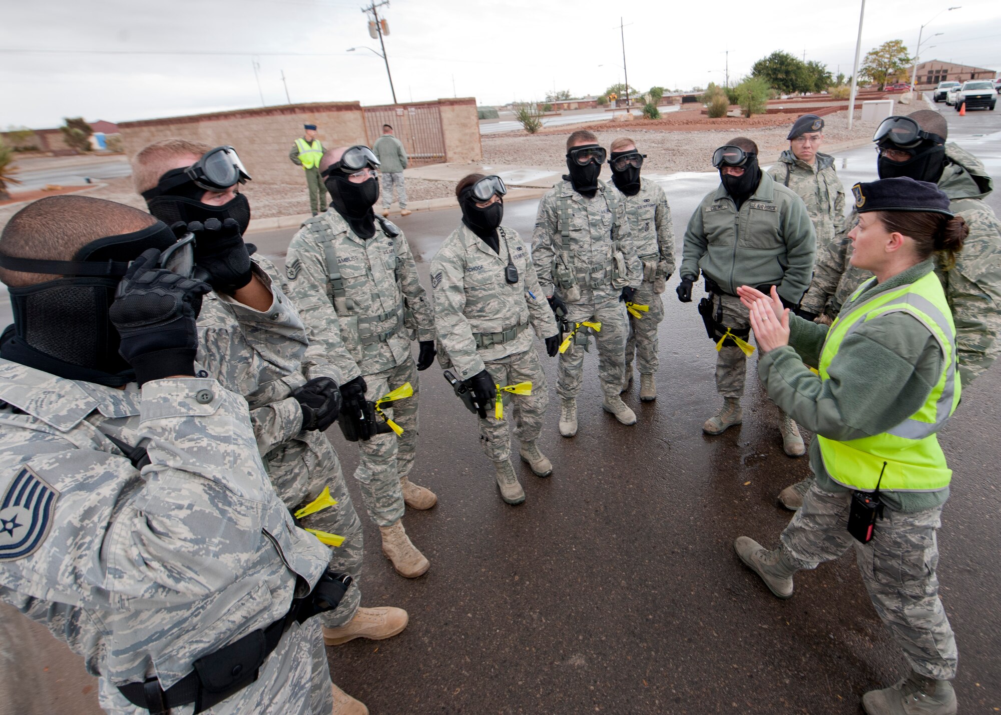 HOLLOMAN AIR FORCE BASE, N.M. -- U.S. Air Force Tech. Sgt. Lisa Parr, 49th Security Force Squadron, discusses proper breaching and clearing techniques Oct. 27, 2011, during a base-wide active shooter exercise. The exercise was conducted to ensure first responders and members from the 49th SFS are adequately trained and have the ability to take appropriate actions in their response to any incident. (U.S. Air Force photo by Senior Airman Veronica Stamps/Released)