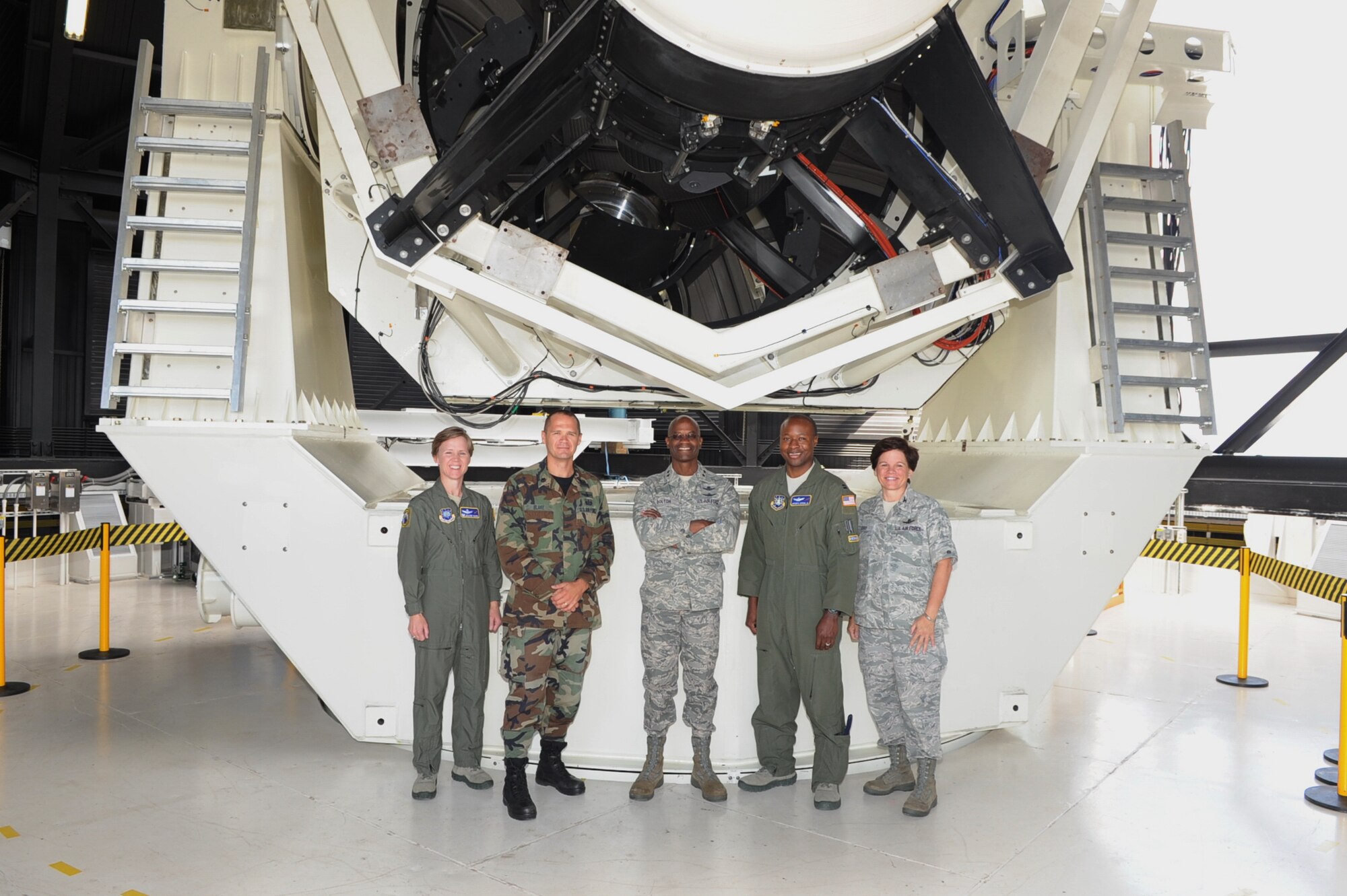 Maj. Gen. Edward Bolton (center), director of Space and Cyber Operations at Headquarters Air Force along with Col. Catherine Perro (right), director of Space Operations at HQ Air Force, received an orientation tour of the 21st Operations Group Detachment 1 at White Sands Missile Range, N.M., Sept. 29. The visit was part of an immersion visit of the space assets in New Mexico. Detachment 1 is a geographically separated unit of the 21st Space Wing that performs deep space observations using three high-powered, 1.2 meter Ground Based Electro Optical Deep Space Surveillance (GEODSS) telescopes. The telescopes can see objects 2,000 - 100,000 kilometers from the earth's surface. The unit is manned 24 hours a day; seven days a week to ensure America's satellites and other space assets can avoid the thousands of space objects that orbit the earth. (U.S. Air Force photo)