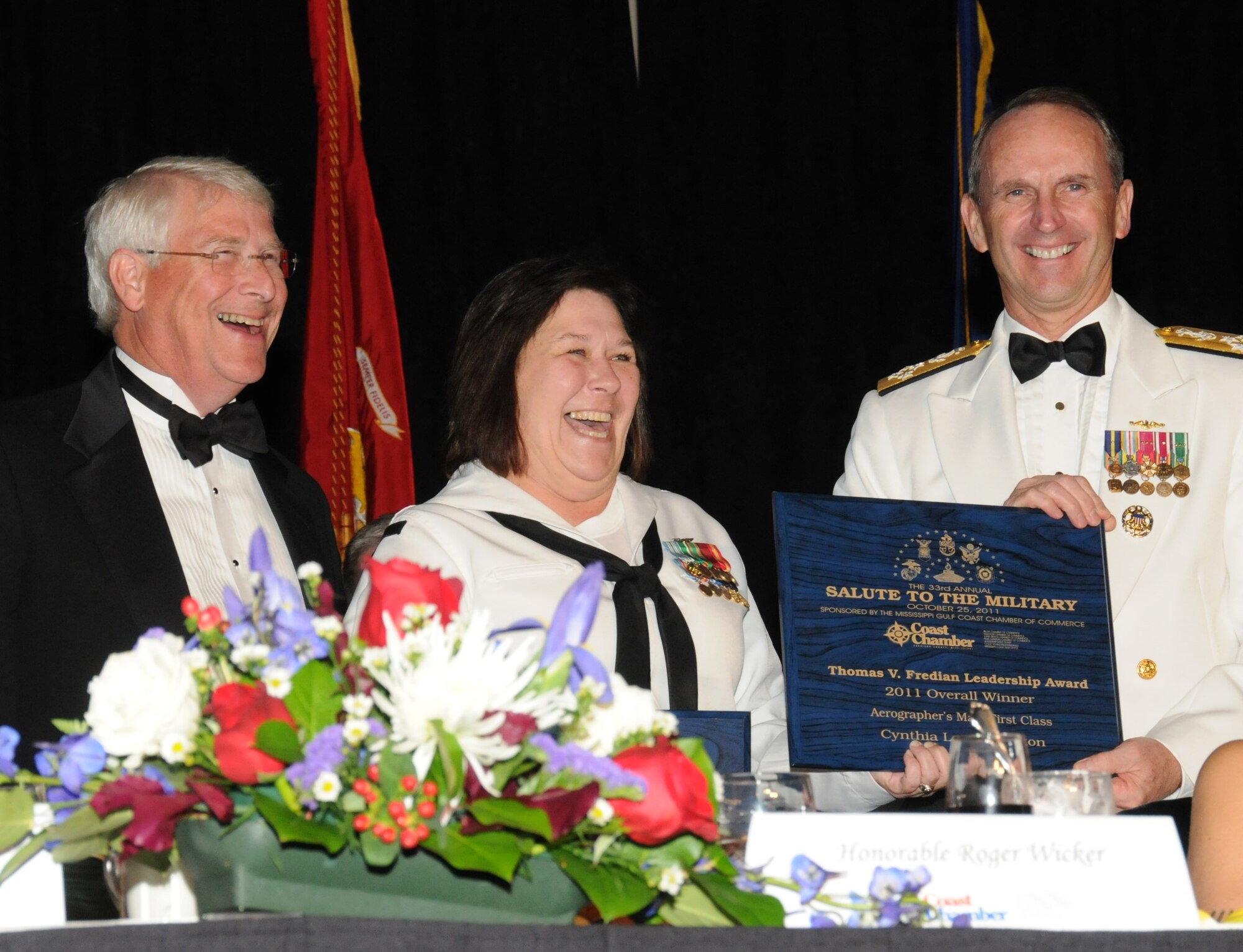 Sen. Roger Wicker, left, and Adm.  Jonathan Greenert, right, congratulate Petty Officer 1st Class Cynthia Burton, recipient of the Thomas V. Fredian Community Leadership Award at the 33rd Annual  Salute to the Military, Oct. 25, 2011, in Biloxi, Miss.  Greenert was the guest speaker and Burton is an instructor at the Center for Naval Aviation Technical Training Unit, Keesler Air Force Base, Miss. Every year at Salute to the Military, one local service member in grade E-6 or below is presented the Thomas V. Fredian Community Leadership Award.  The award honors professional performance and leadership, community involvement and education over the past year.   The event, sponsored by the Mississippi Gulf Coast Chamber of Commerce, was held at the Mississippi Coast Coliseum in Biloxi.  (U.S. Air Force photo by Kemberly Groue)