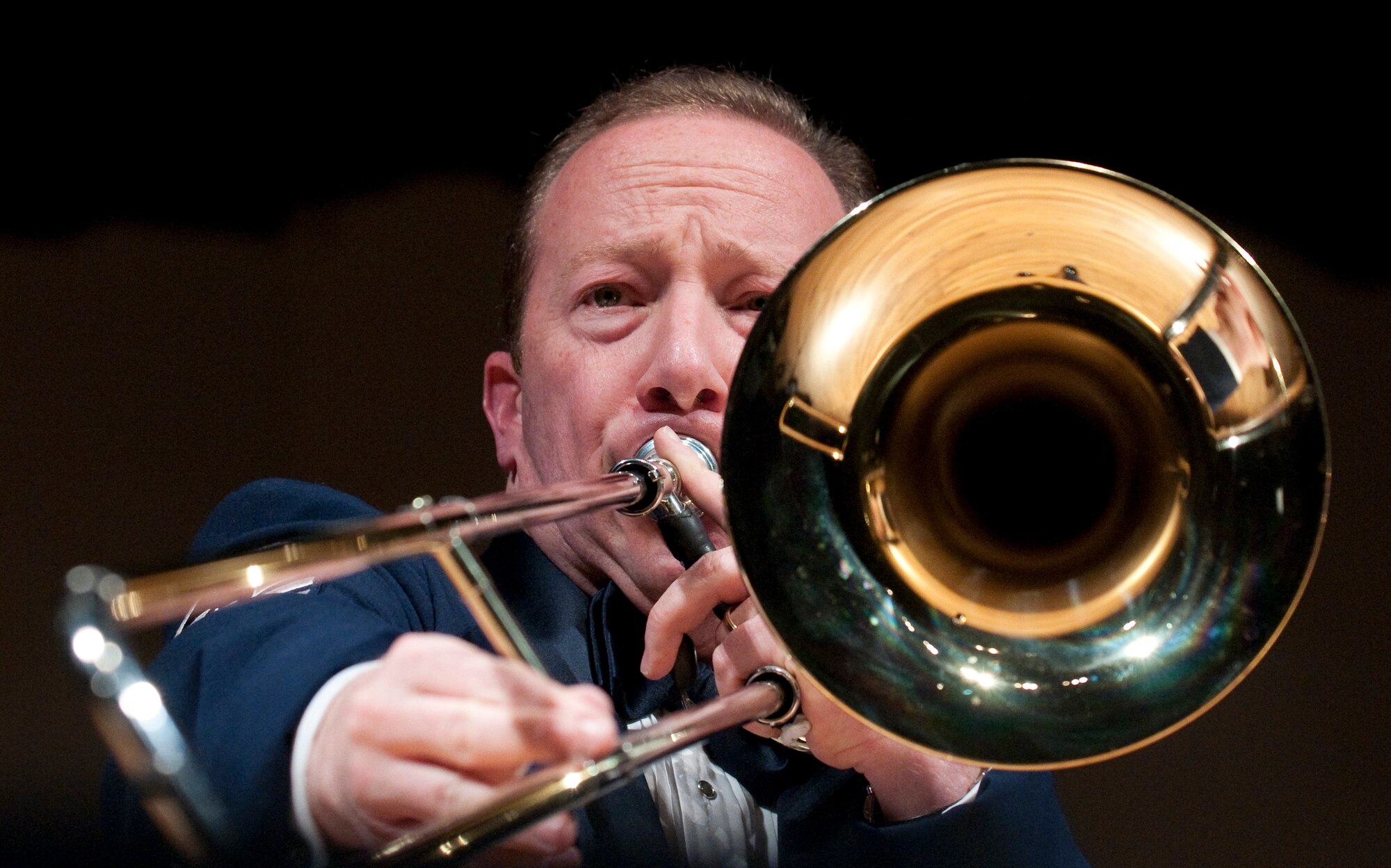 Master Sgt. Jay Heltzer, United States Air Force Concert Band, plays the bass trombone during a performance in the Cheyenne Civic Center in Cheyenne, Wyo., Oct. 18. The Cheyenne performance, in front of an audience of 1,400 people, was part of the band’s fall, western tour which includes stops in Montana, South Dakota Wyoming and Nebraska. (U.S. Air Force photo by R.J. Oriez)